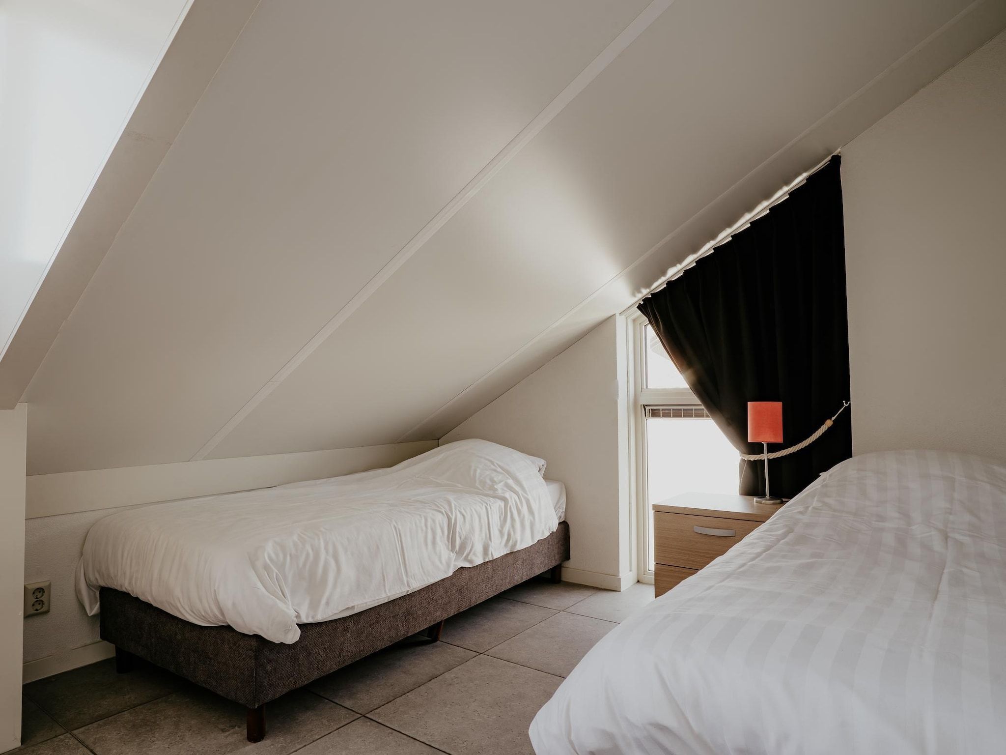 Een slaapkamer van Waterpark de Meerparel 4 in Uitgeest