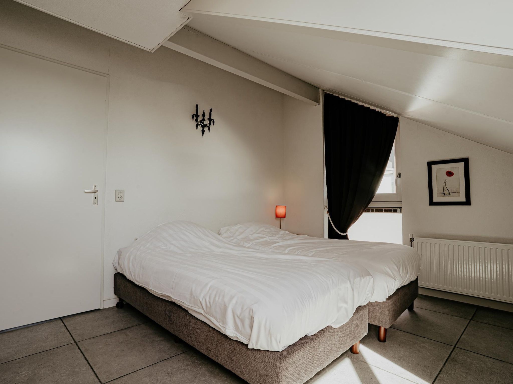 Een slaapkamer van Waterpark de Meerparel 4 in Uitgeest