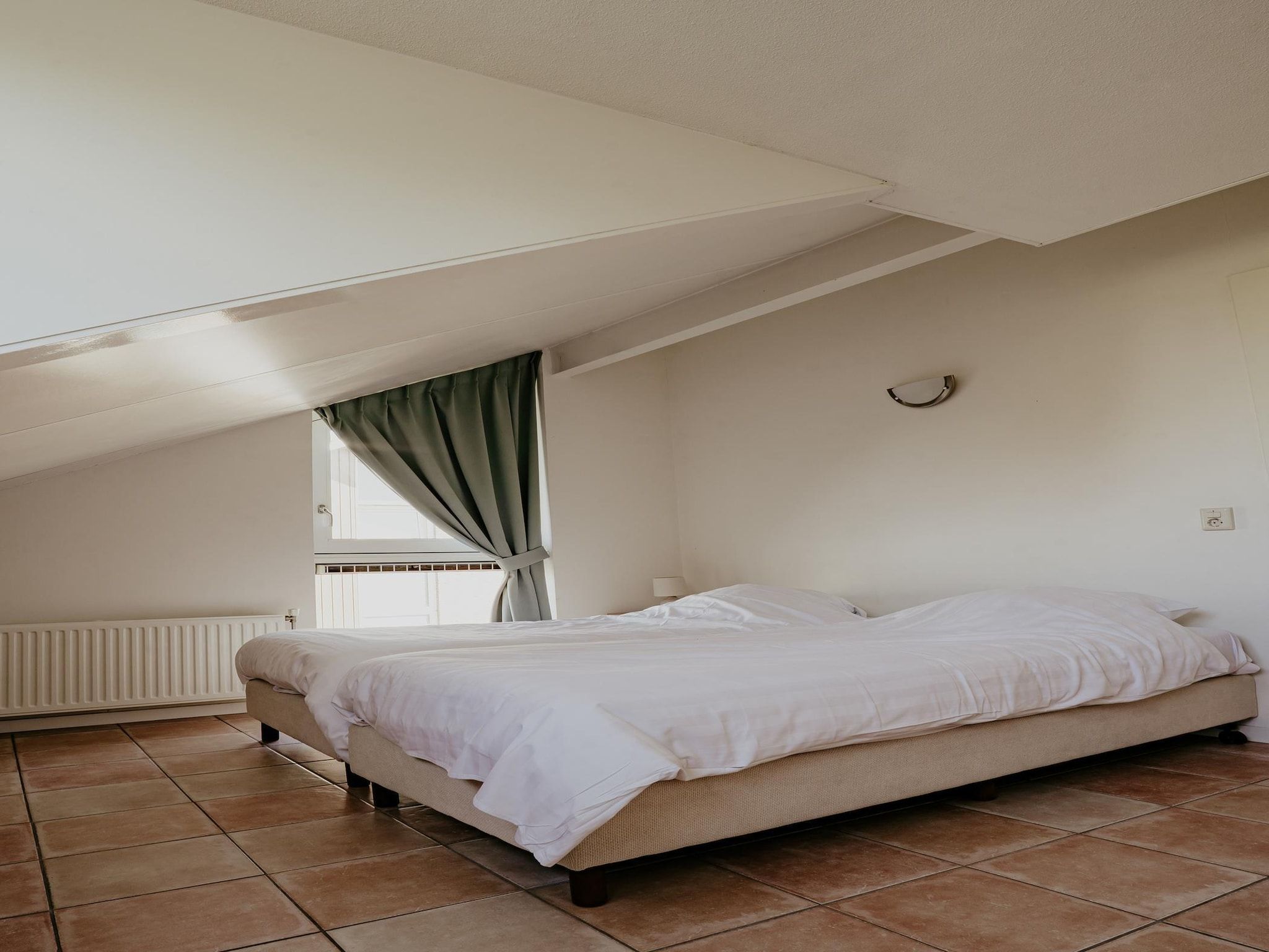 Een slaapkamer van Waterpark de MeerParel 3 in Uitgeest