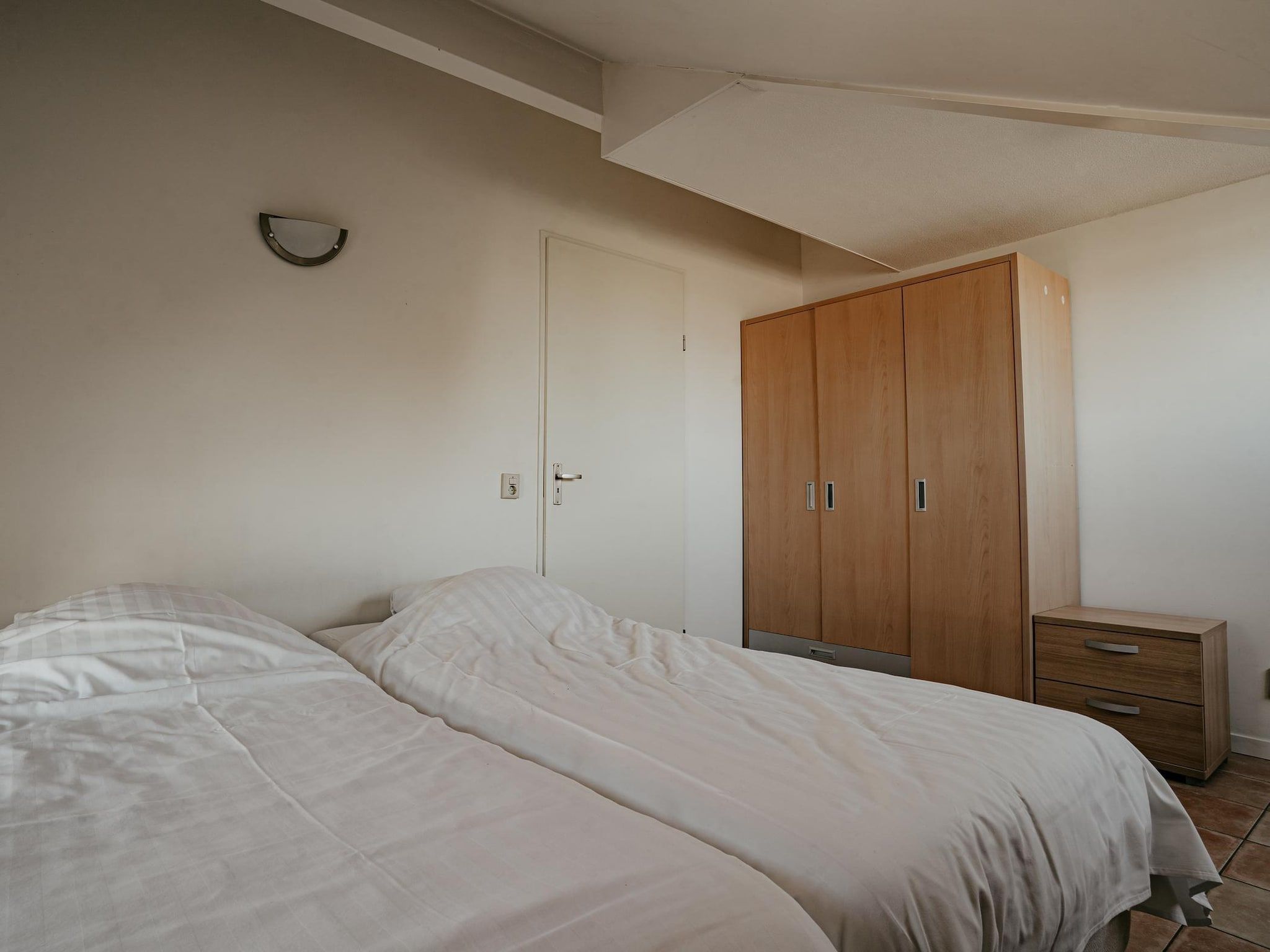 Een slaapkamer van Waterpark de MeerParel 3 in Uitgeest