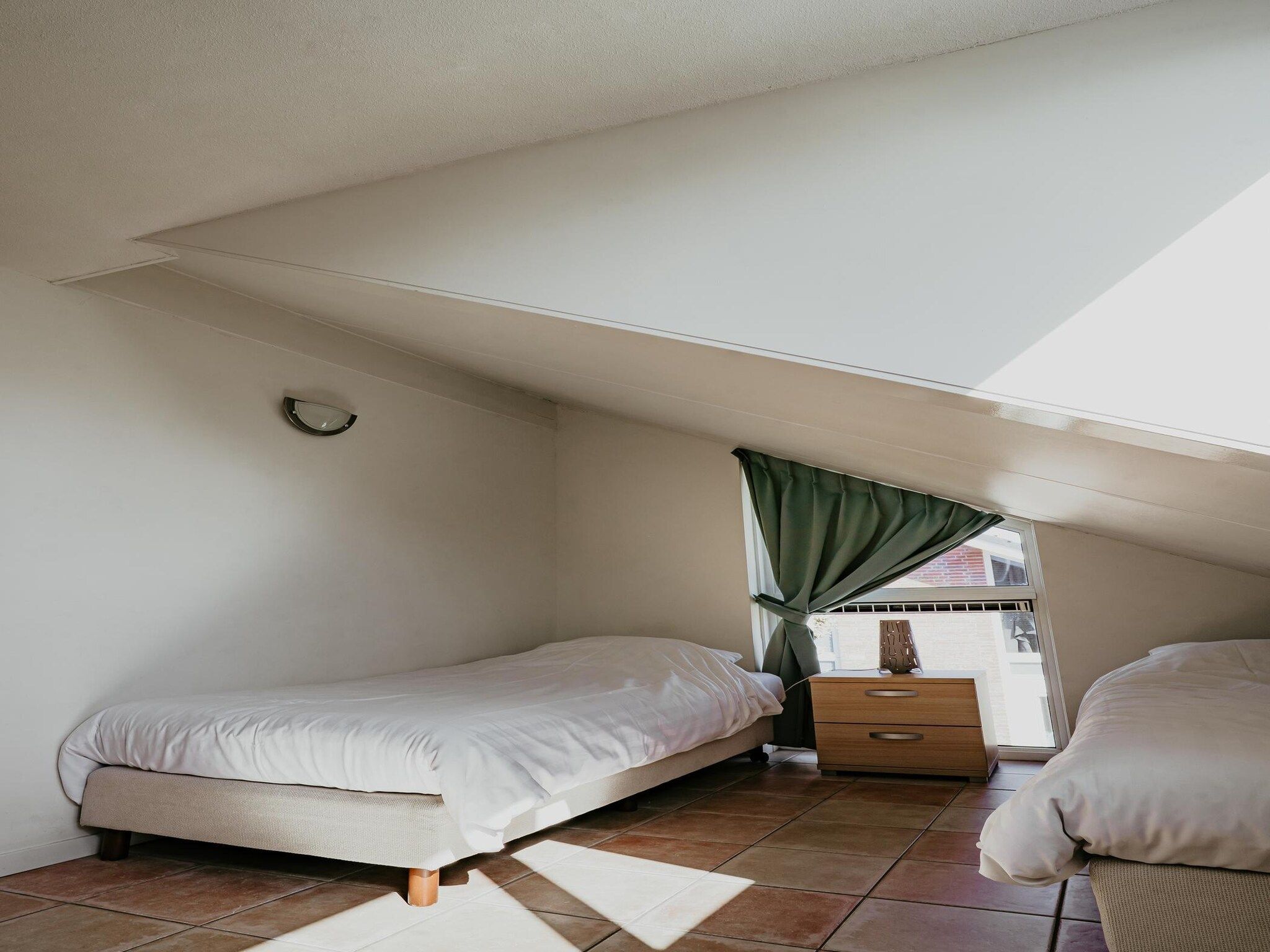 Een slaapkamer van Waterpark de MeerParel 3 in Uitgeest