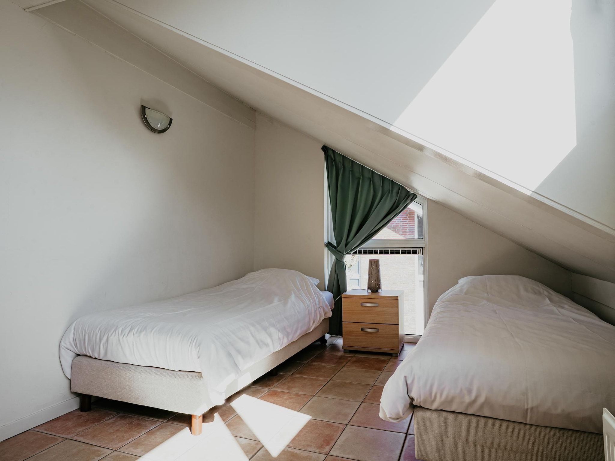 Een slaapkamer van Waterpark de MeerParel 3 in Uitgeest