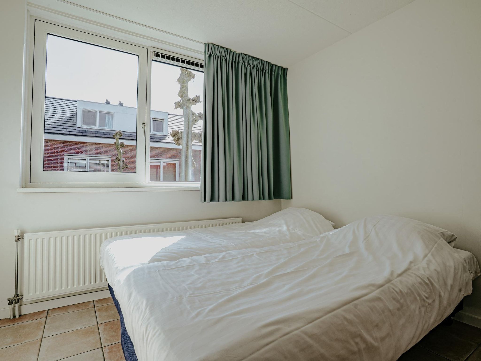 Een slaapkamer van Waterpark de MeerParel 3 in Uitgeest