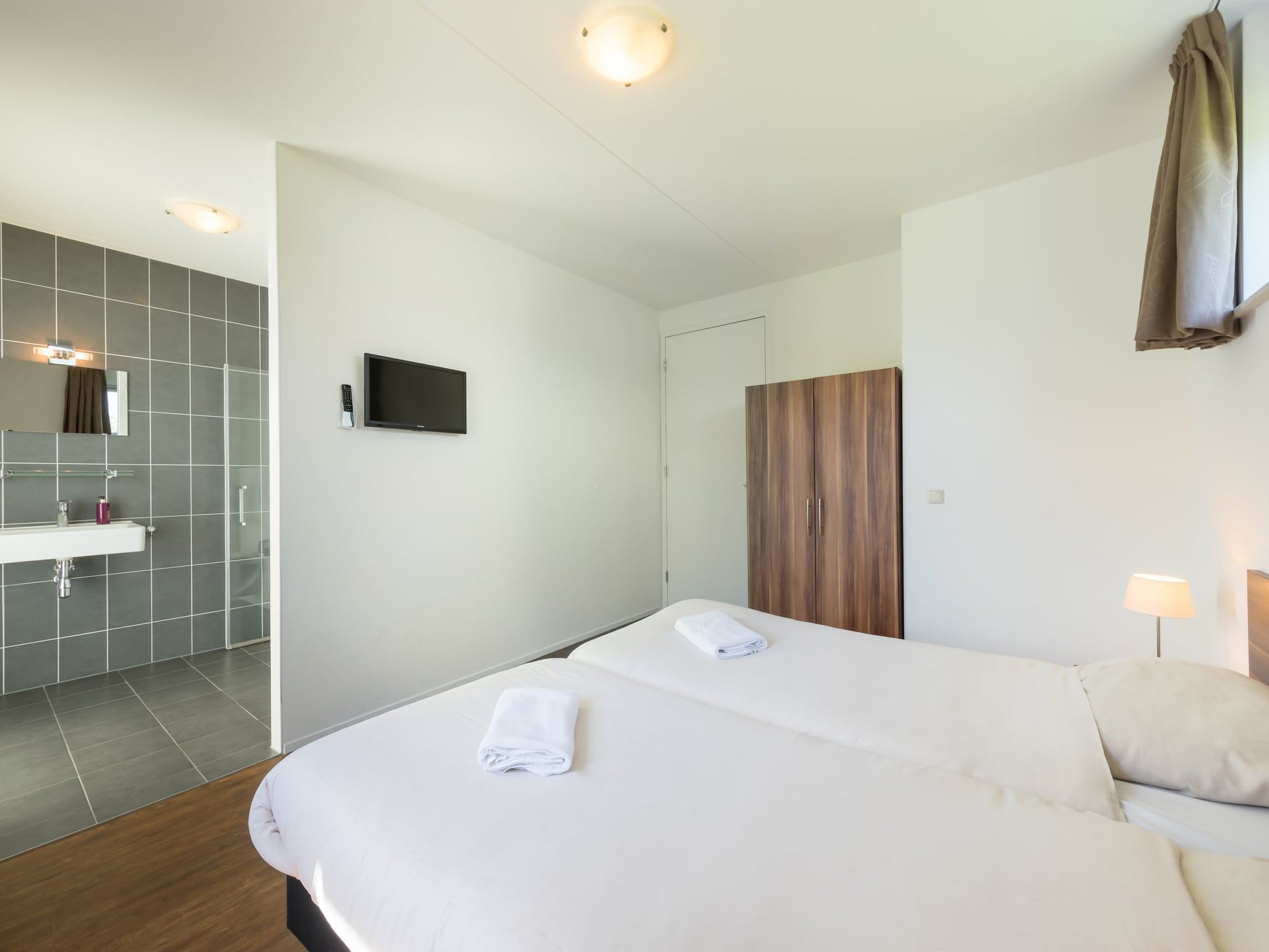 Een slaapkamer van Résidence de Weerribben 2 in Paasloo