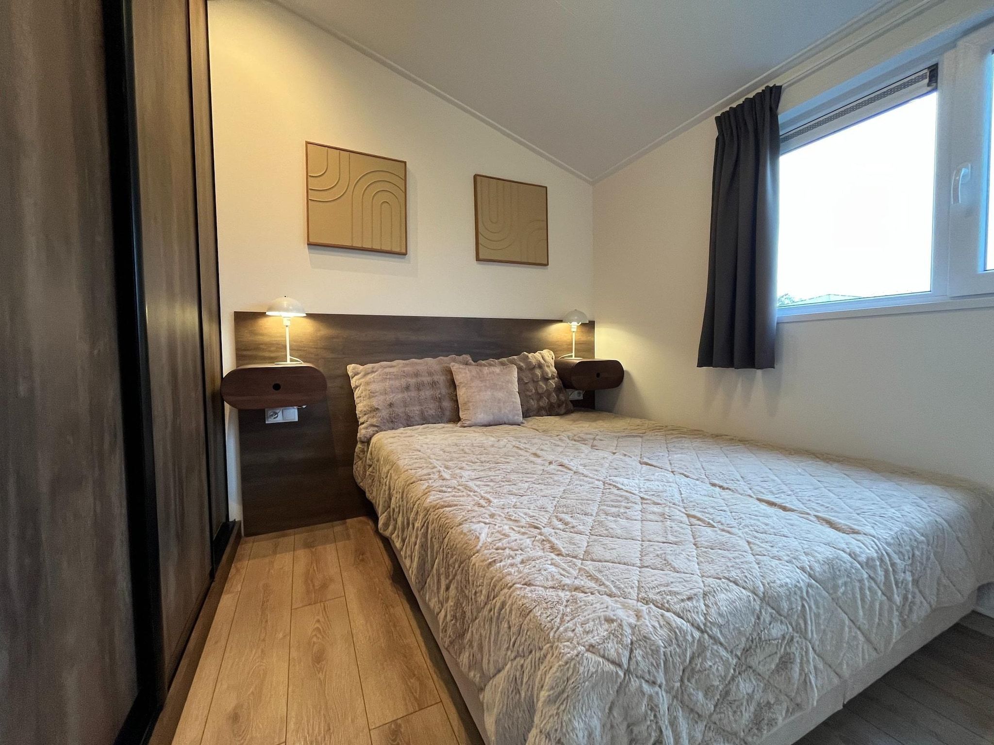 Een slaapkamer van Waaghuys  6 personen in West-Graftdijk