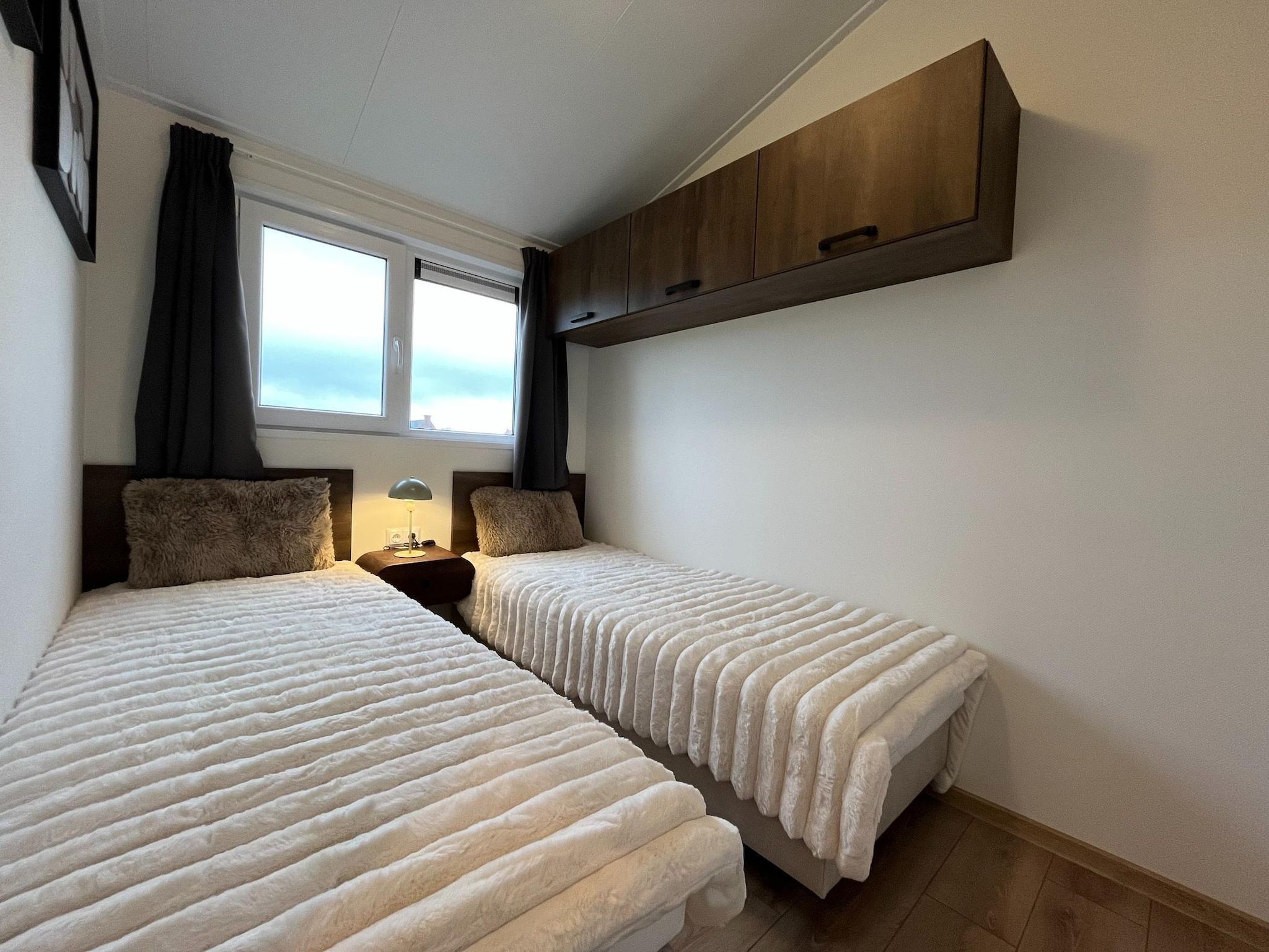 Een slaapkamer van Waaghuys  6 personen in West-Graftdijk