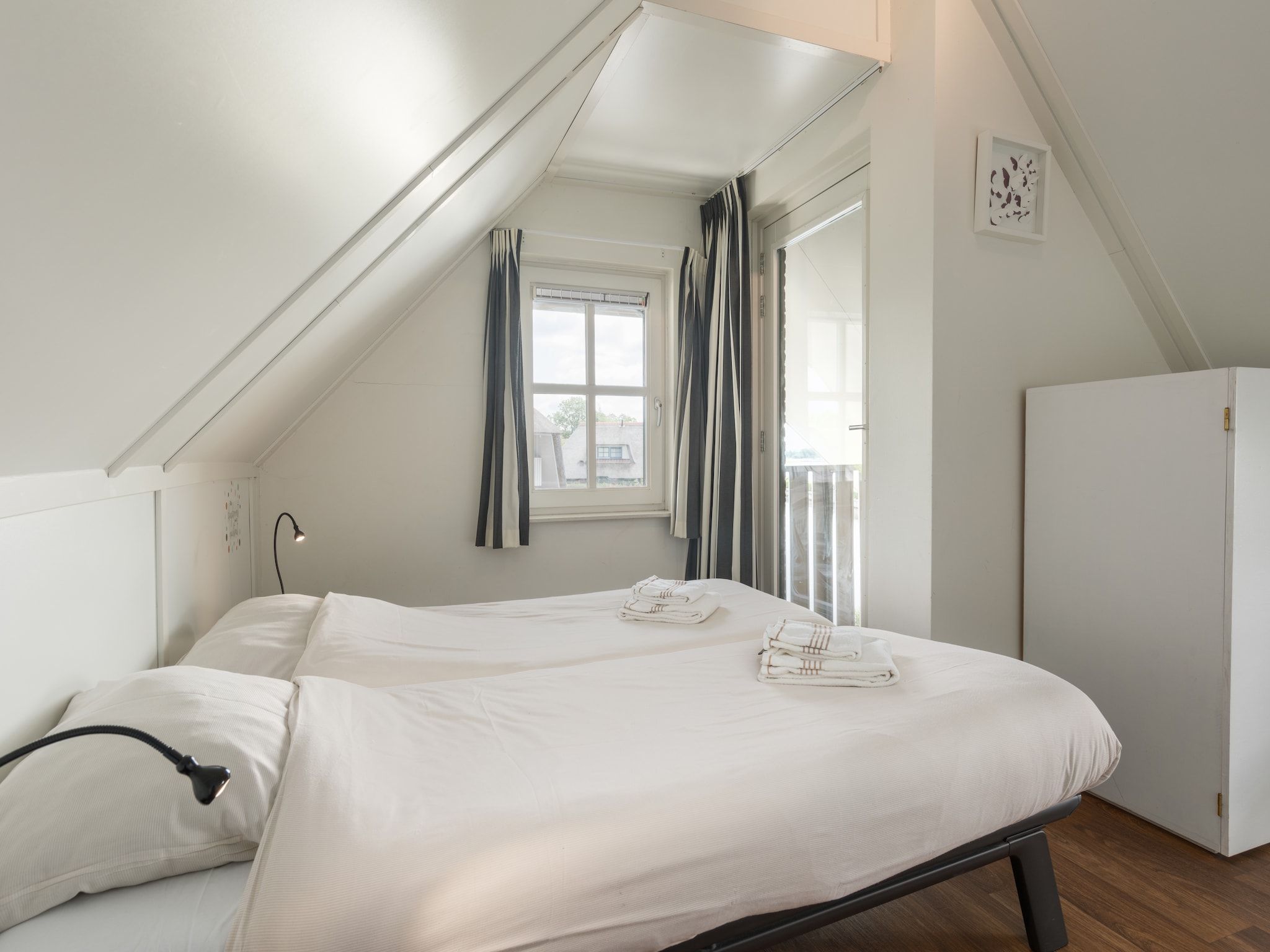 Een slaapkamer van Waterpark Belterwiede 2 in Wanneperveen