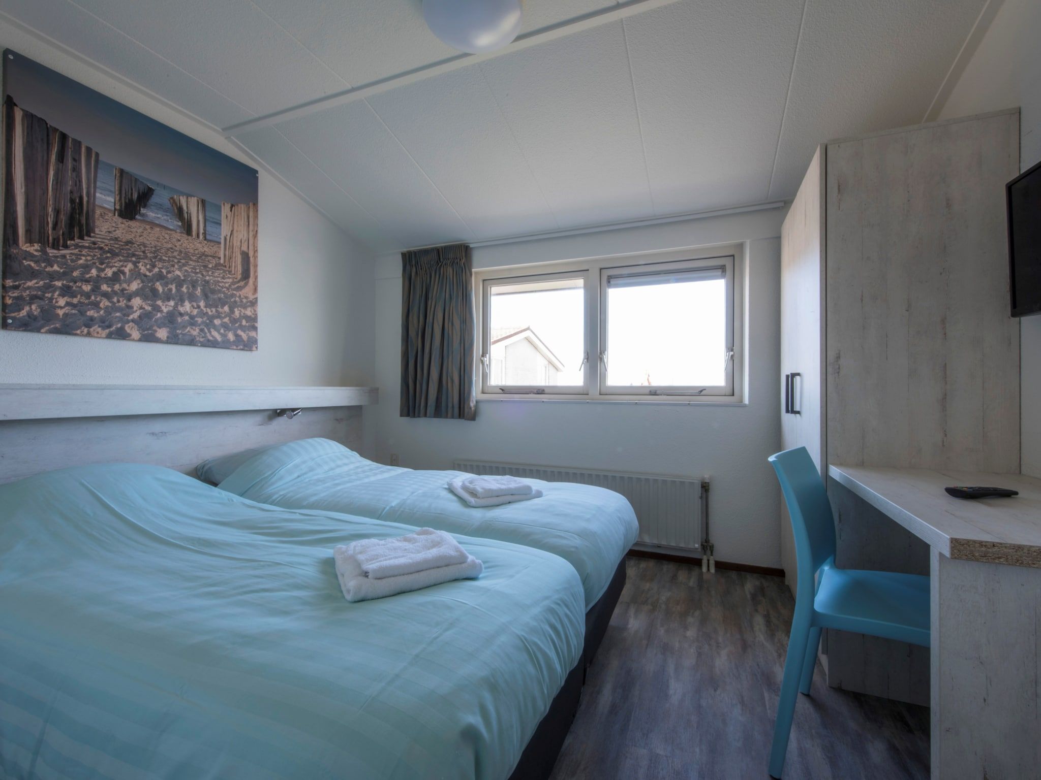 Een slaapkamer van Roompot Beach Resort 5 in Kamperland