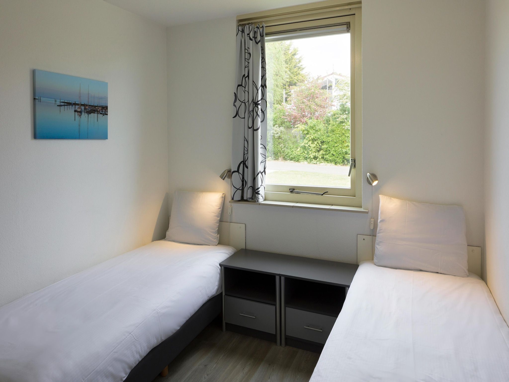 Een slaapkamer van Roompot Beach Resort 20 in Kamperland