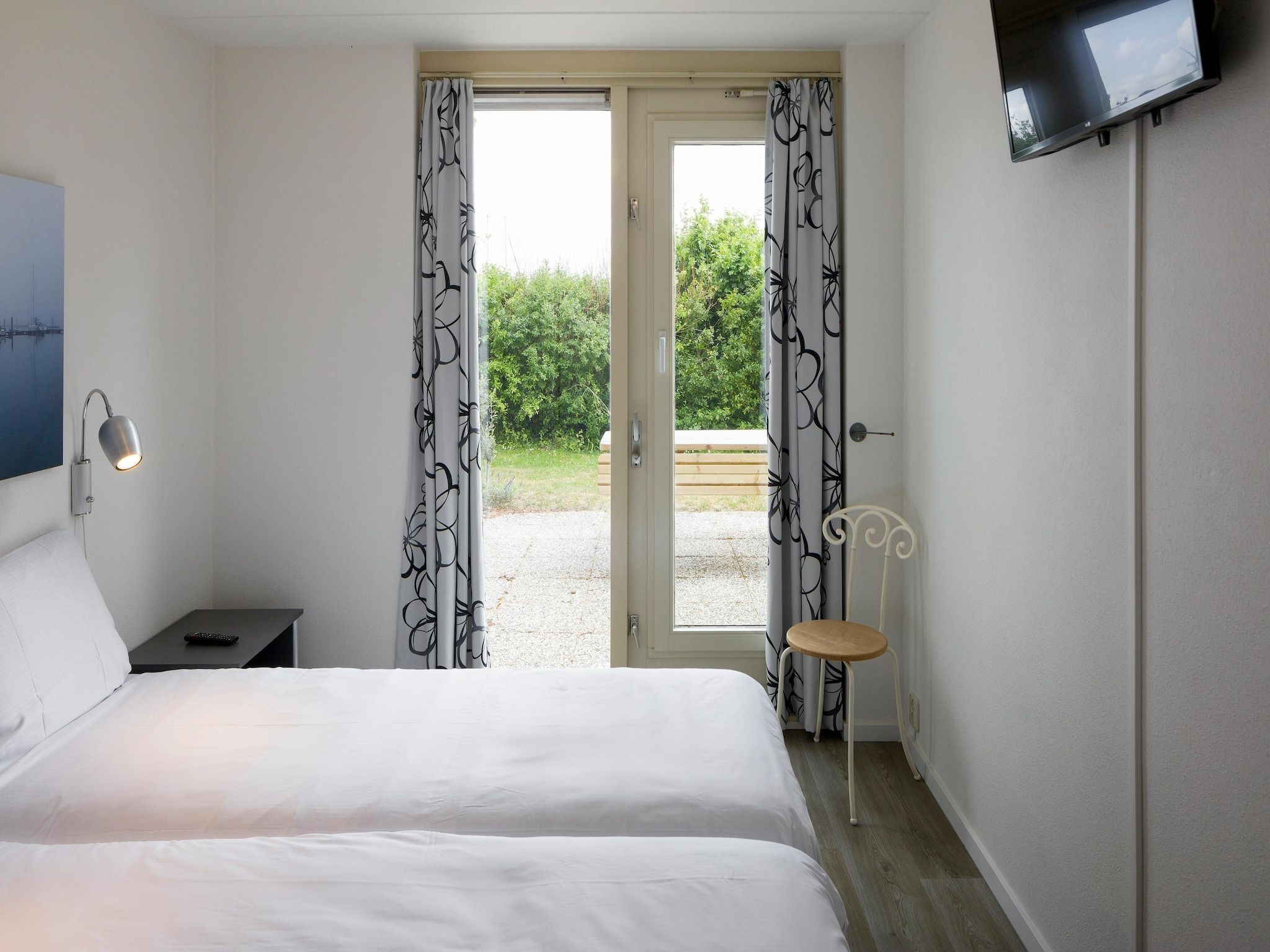 Een slaapkamer van Roompot Beach Resort 20 in Kamperland