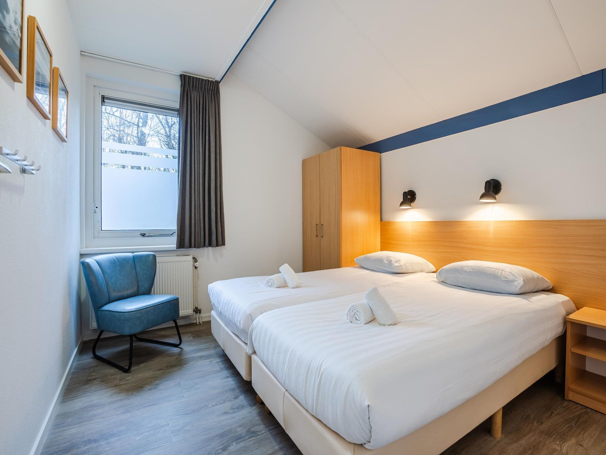 Een slaapkamer van Boomhiemke Duinbungalow 4 in Hollum