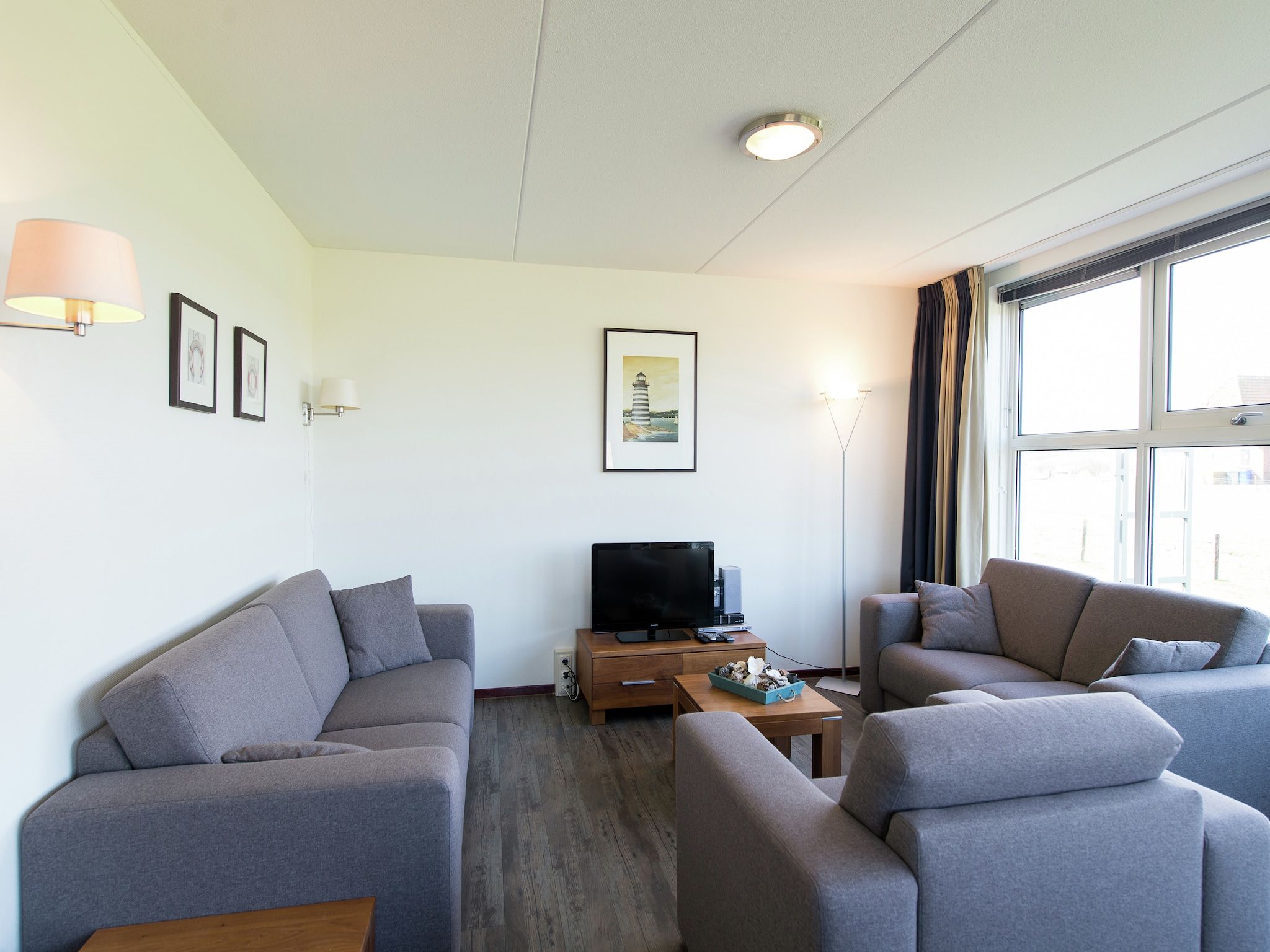 De woonkamer van Vakantiepark Boomhiemke 1 in Hollum