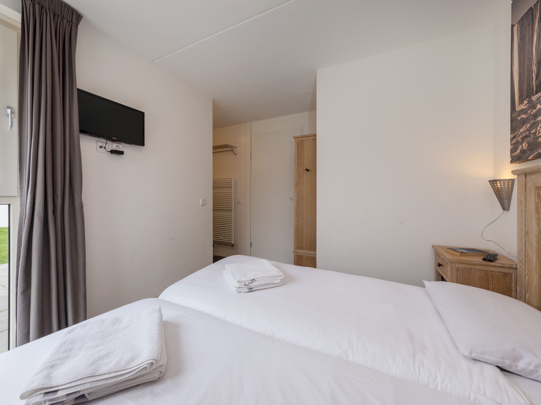 Een slaapkamer van Kustpark Texel 4 in De Koog