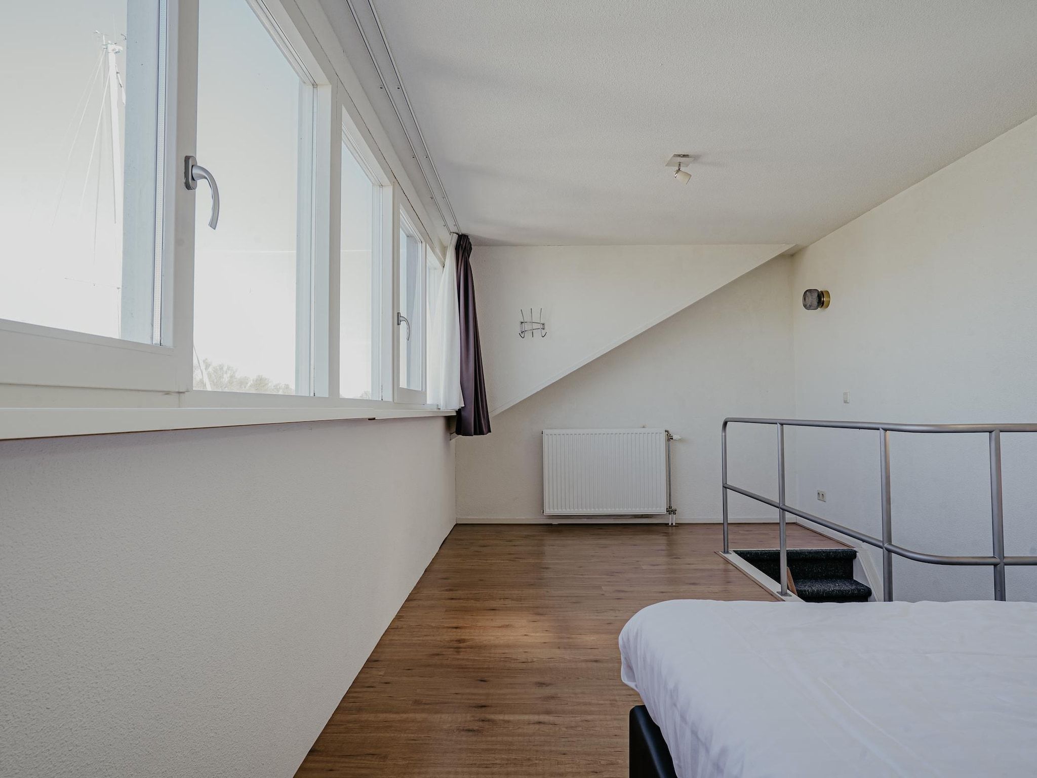 Een slaapkamer van Waterpark de Meerparel 2 in Uitgeest