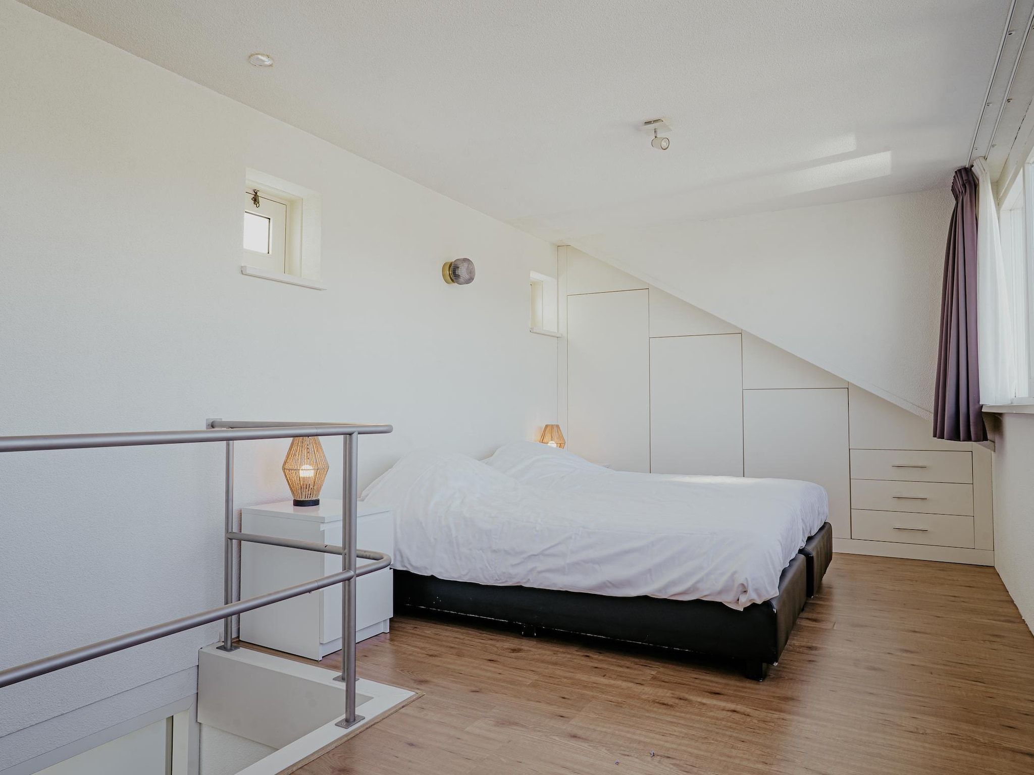 Een slaapkamer van Waterpark de Meerparel 2 in Uitgeest