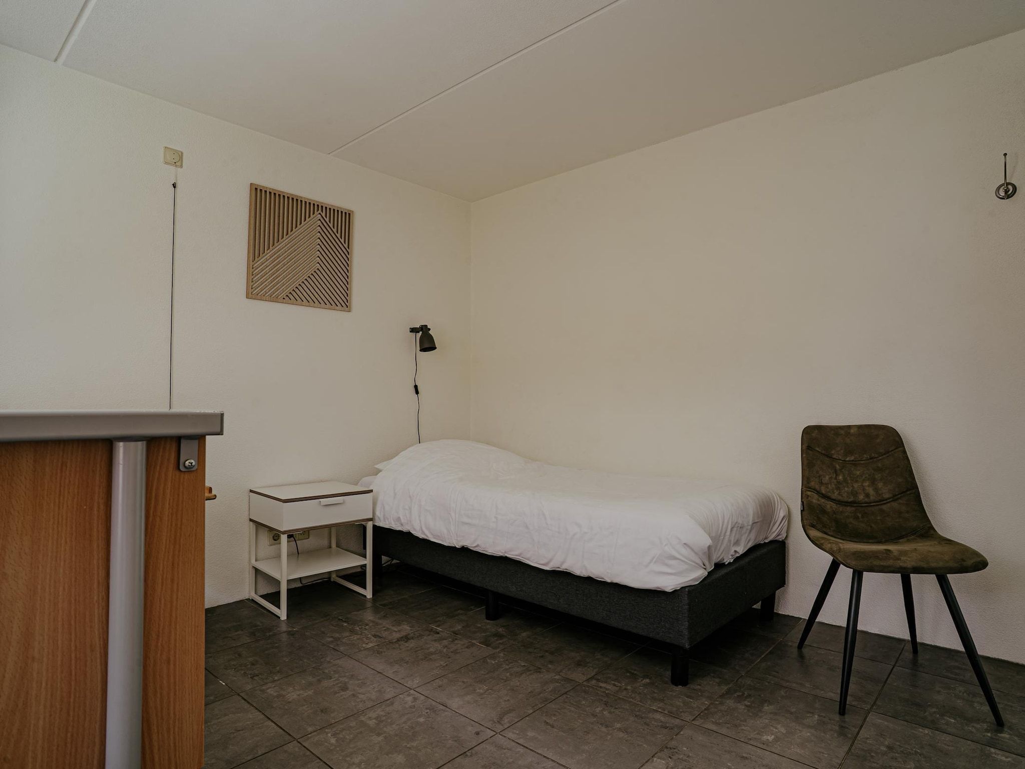 Een slaapkamer van Waterpark de Meerparel 2 in Uitgeest