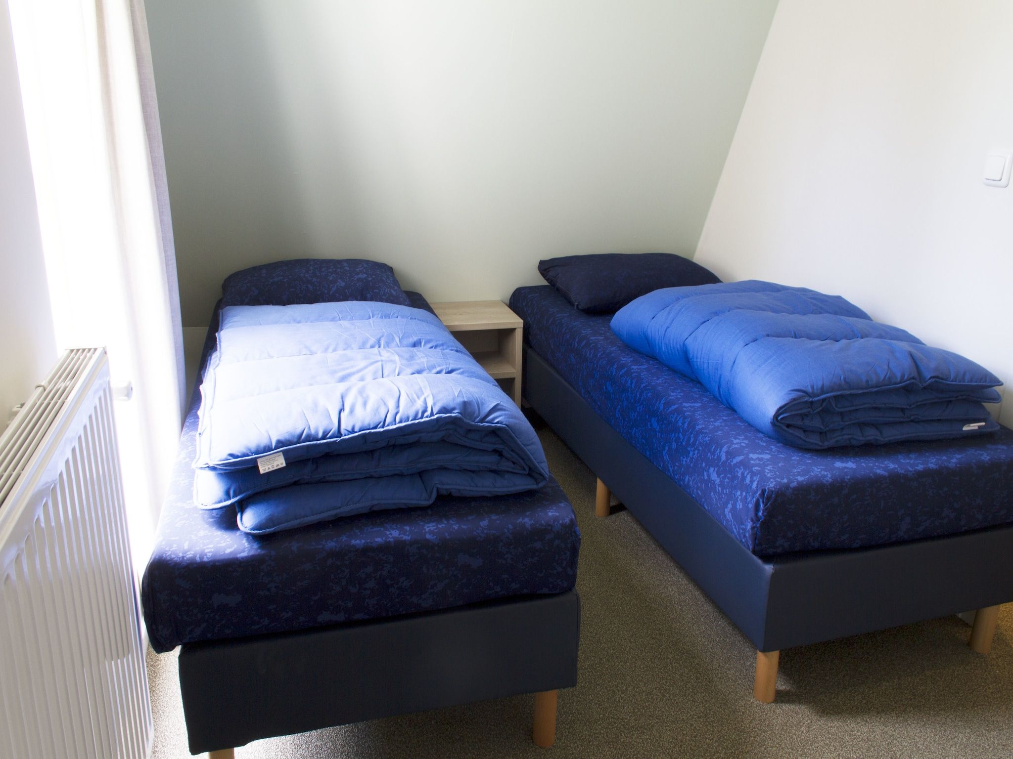 Een slaapkamer van Bungalowpark Hoenderloo 5 in Hoenderloo