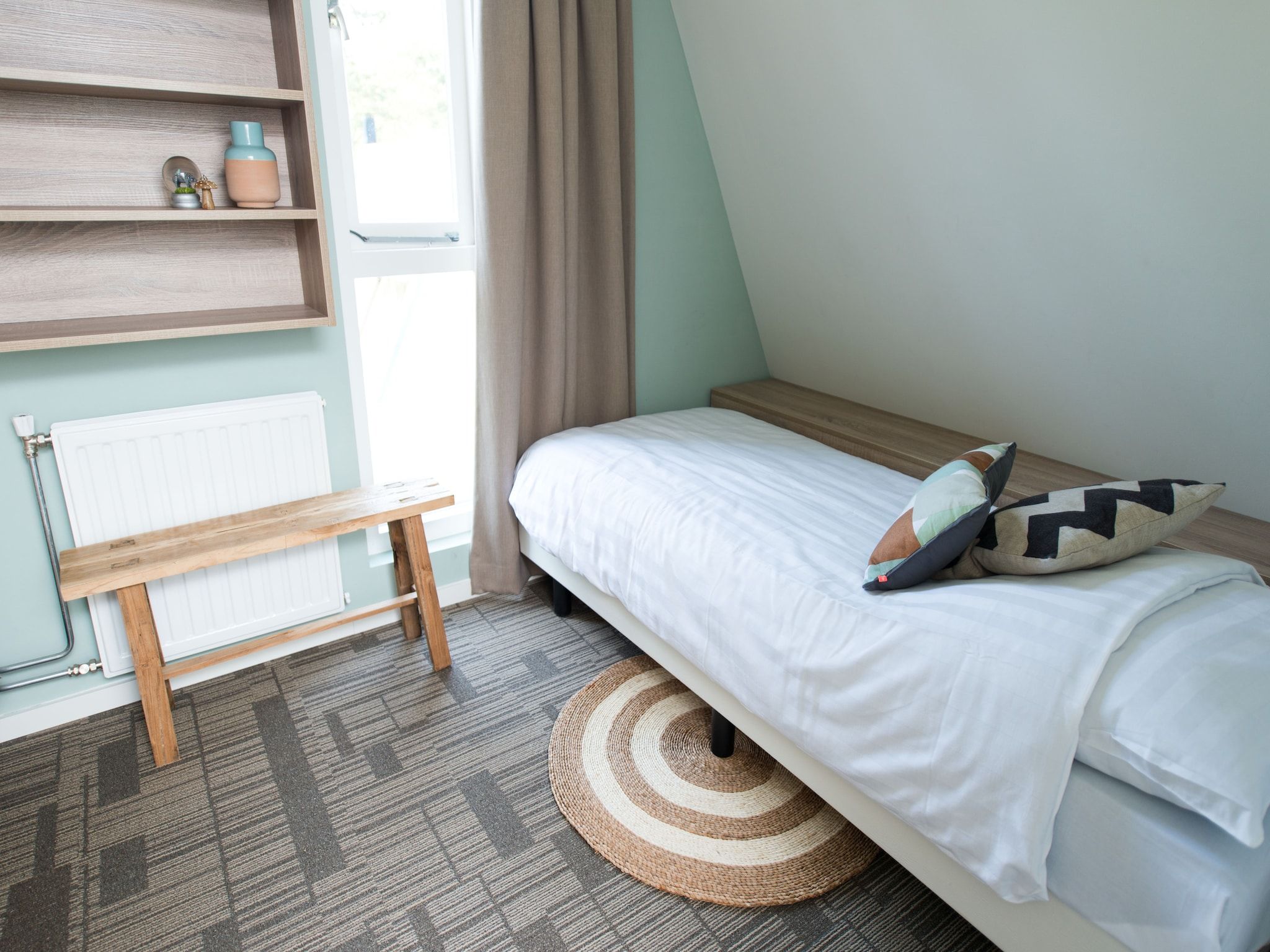 Een slaapkamer van Bungalowpark Hoenderloo 5 in Hoenderloo