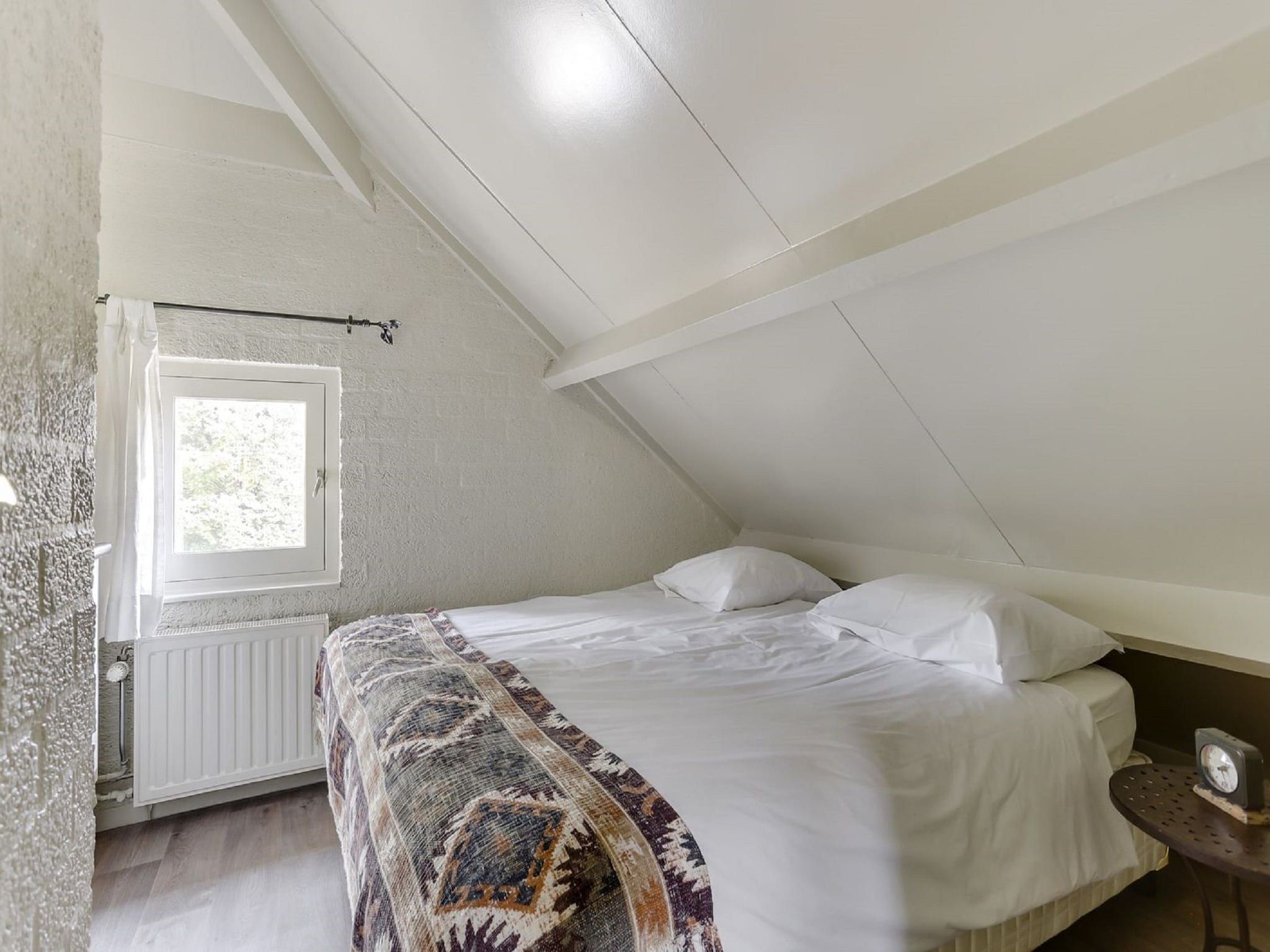 Een slaapkamer van Vakantiepark Sandberghe 5 in Uden