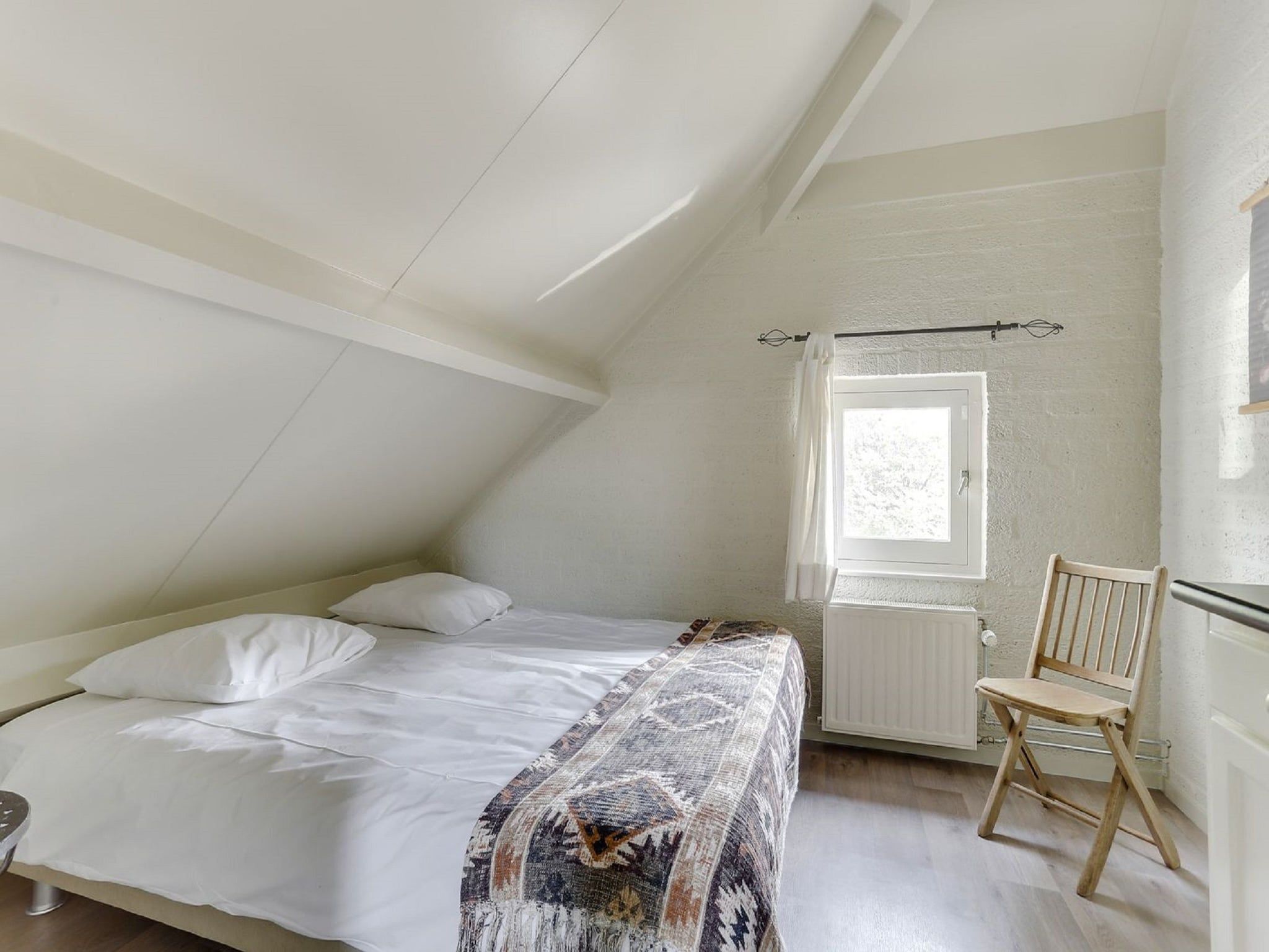 Een slaapkamer van Vakantiepark Sandberghe 5 in Uden