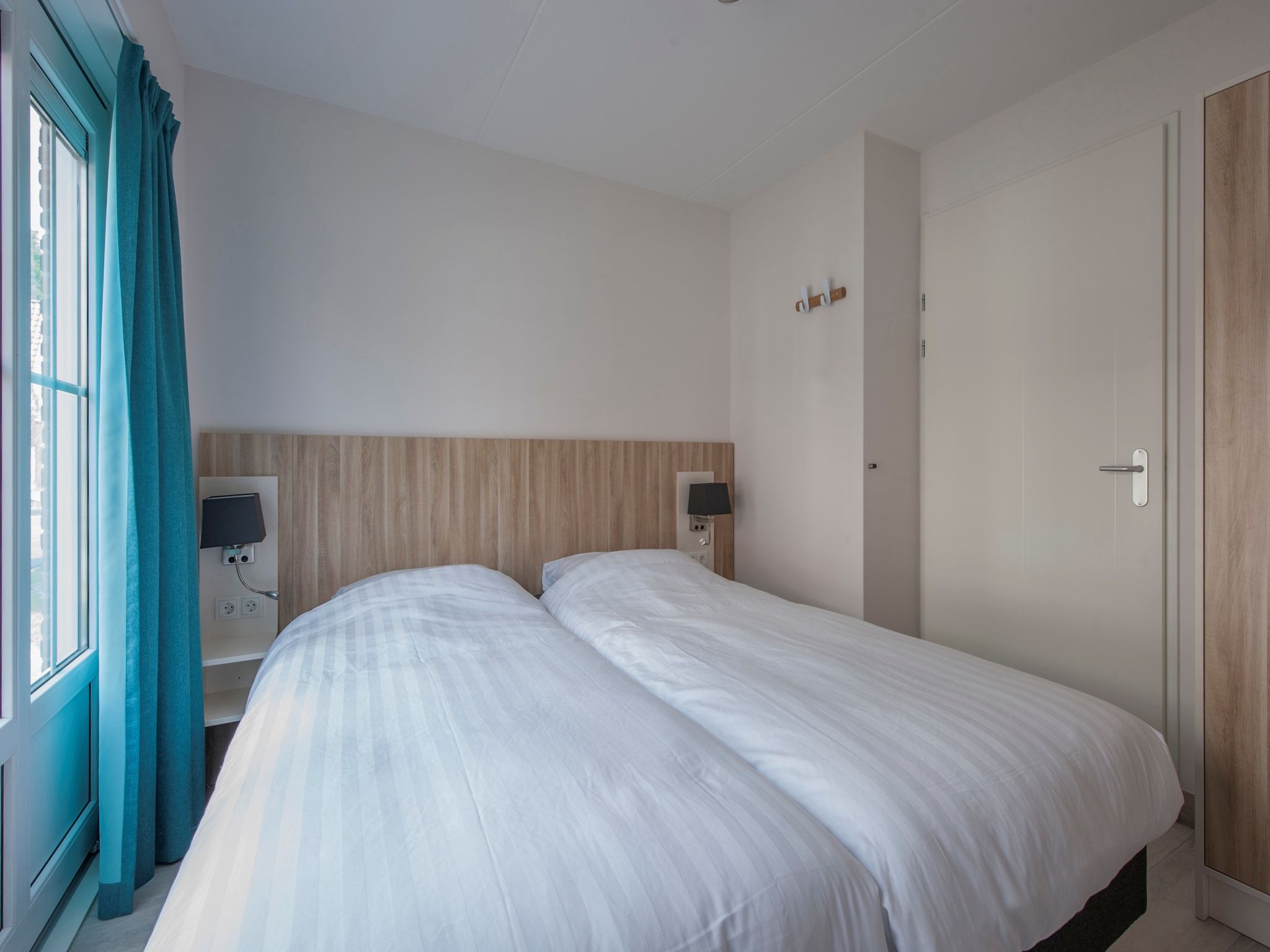 Een slaapkamer van Noordzee Résidence Dishoek 11 in Koudekerke