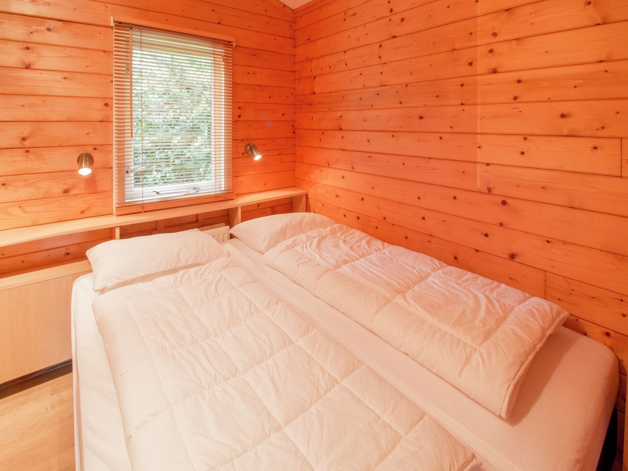 Een slaapkamer van Chaletpark Kuiperberg 4 in Ootmarsum