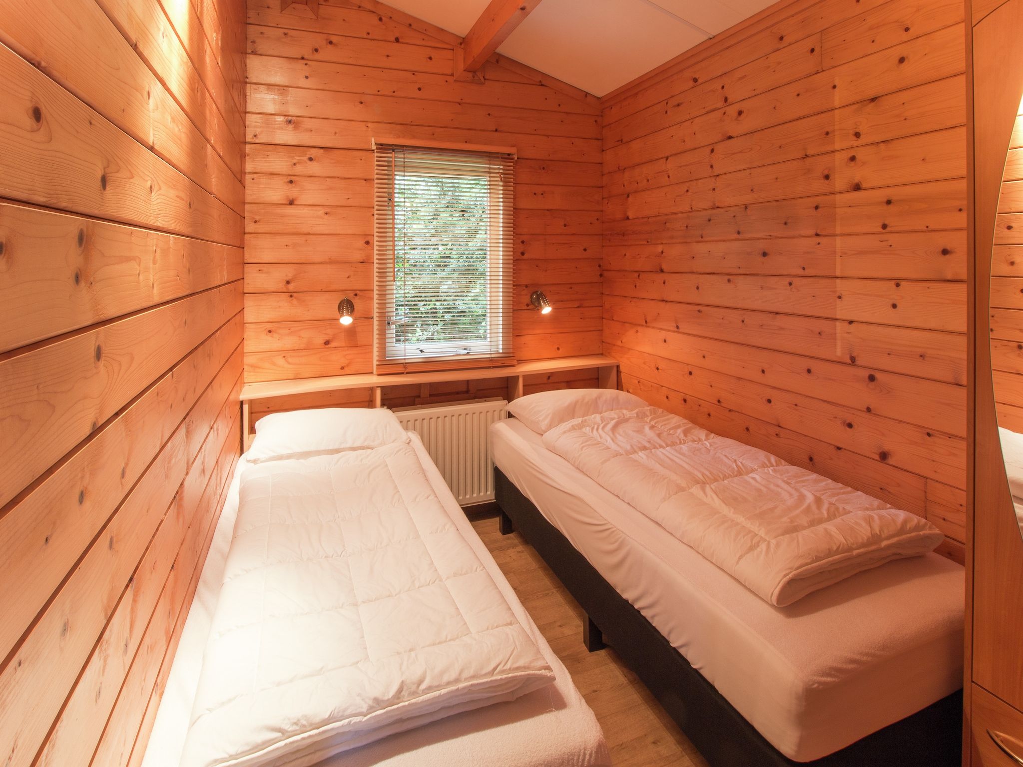 Een slaapkamer van Chaletpark Kuiperberg 4 in Ootmarsum