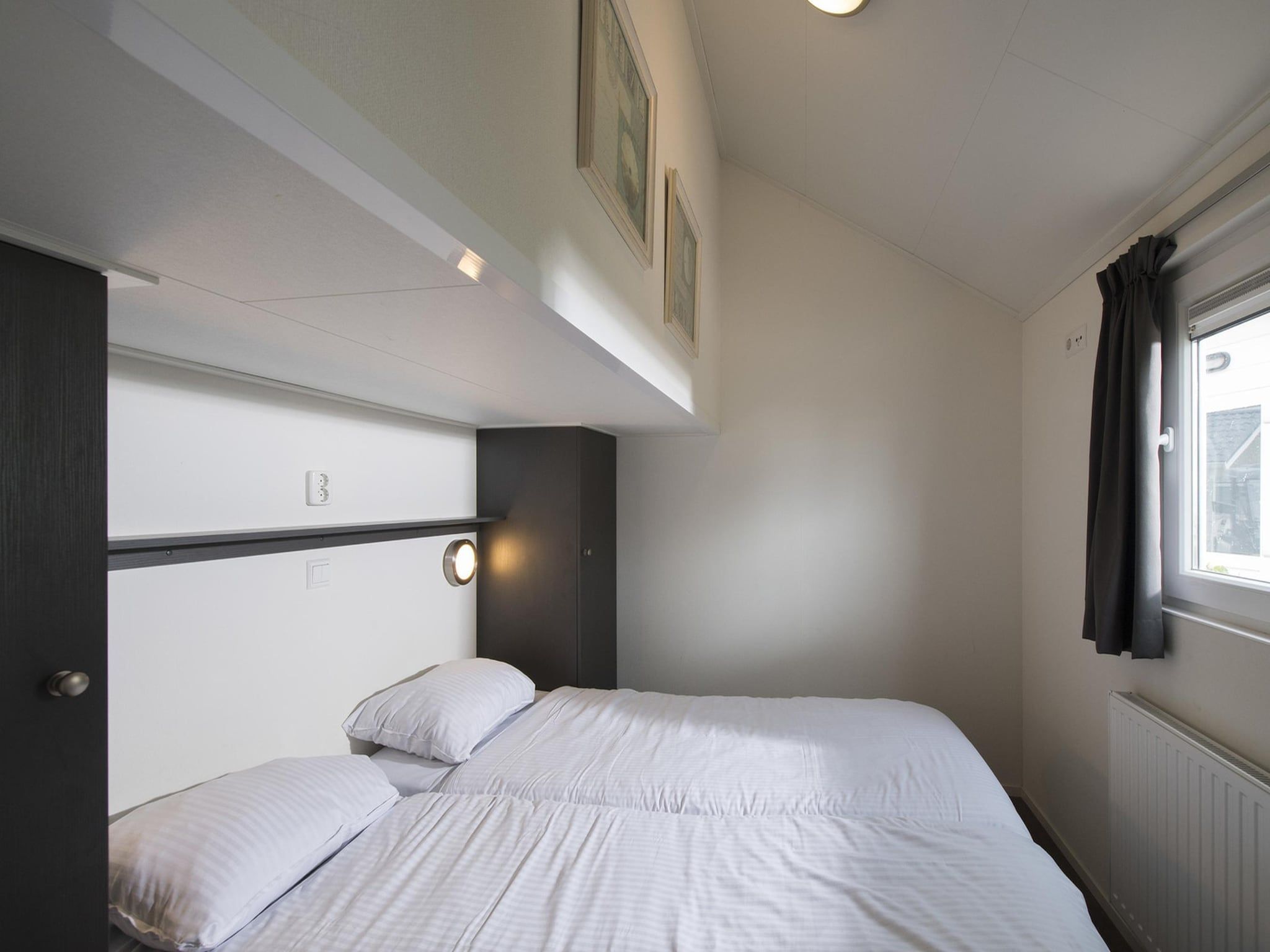 Een slaapkamer van Vakantiepark Eiland van Maurik 2 in Maurik