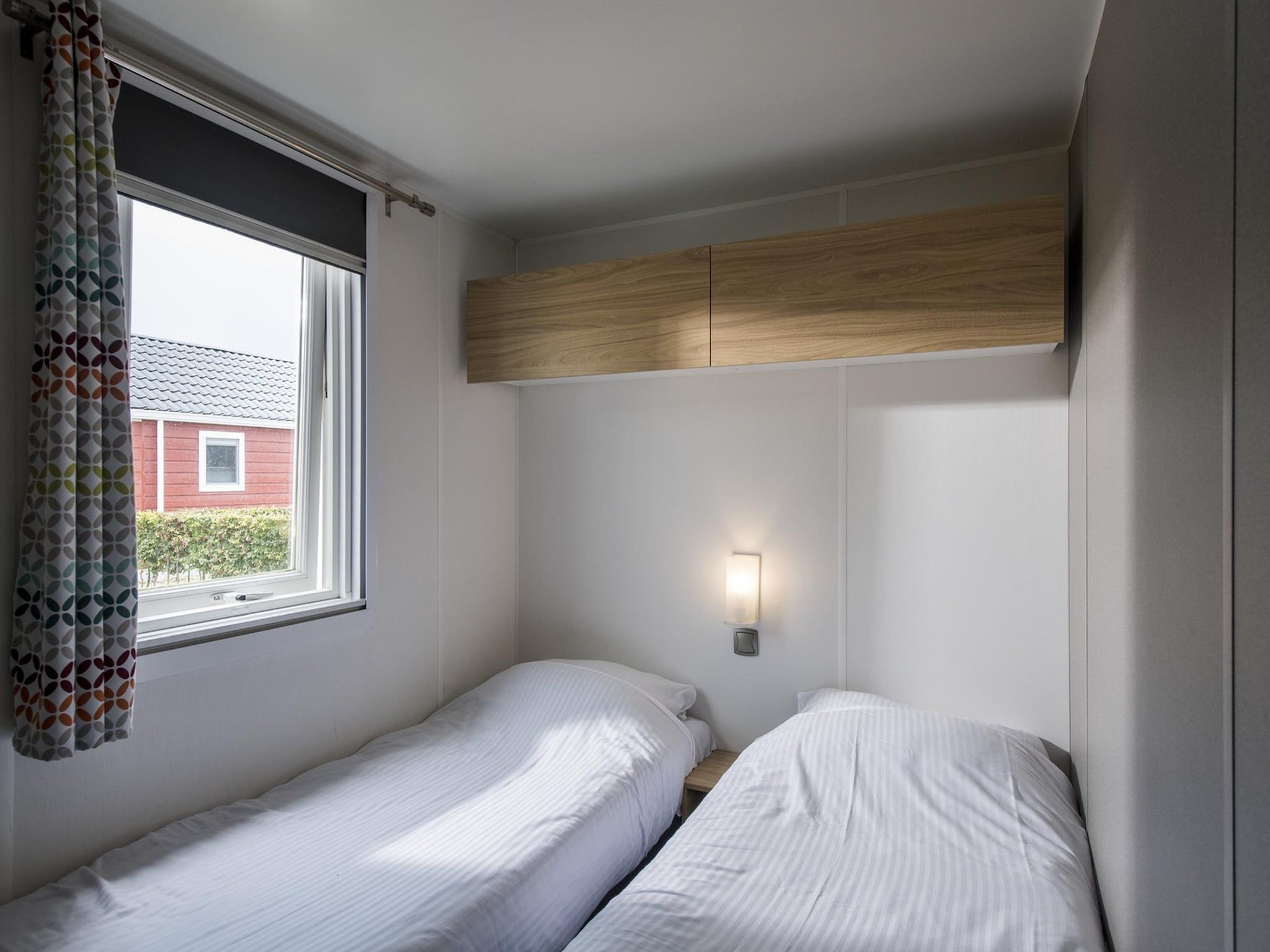 Een slaapkamer van Vakantiepark Eiland van Maurik 3 in Maurik