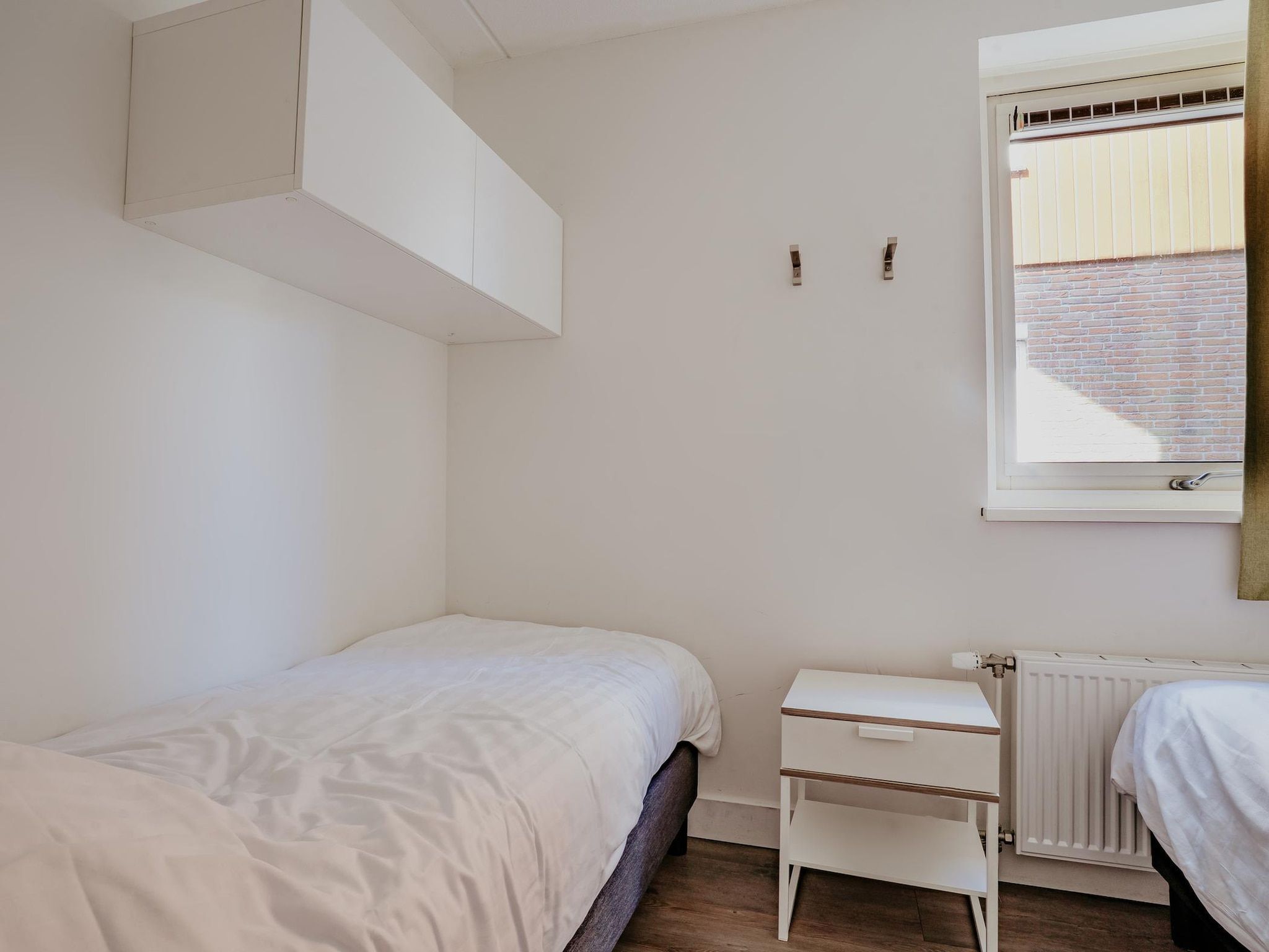 Een slaapkamer van Waterpark de Meerparel  1 in Uitgeest