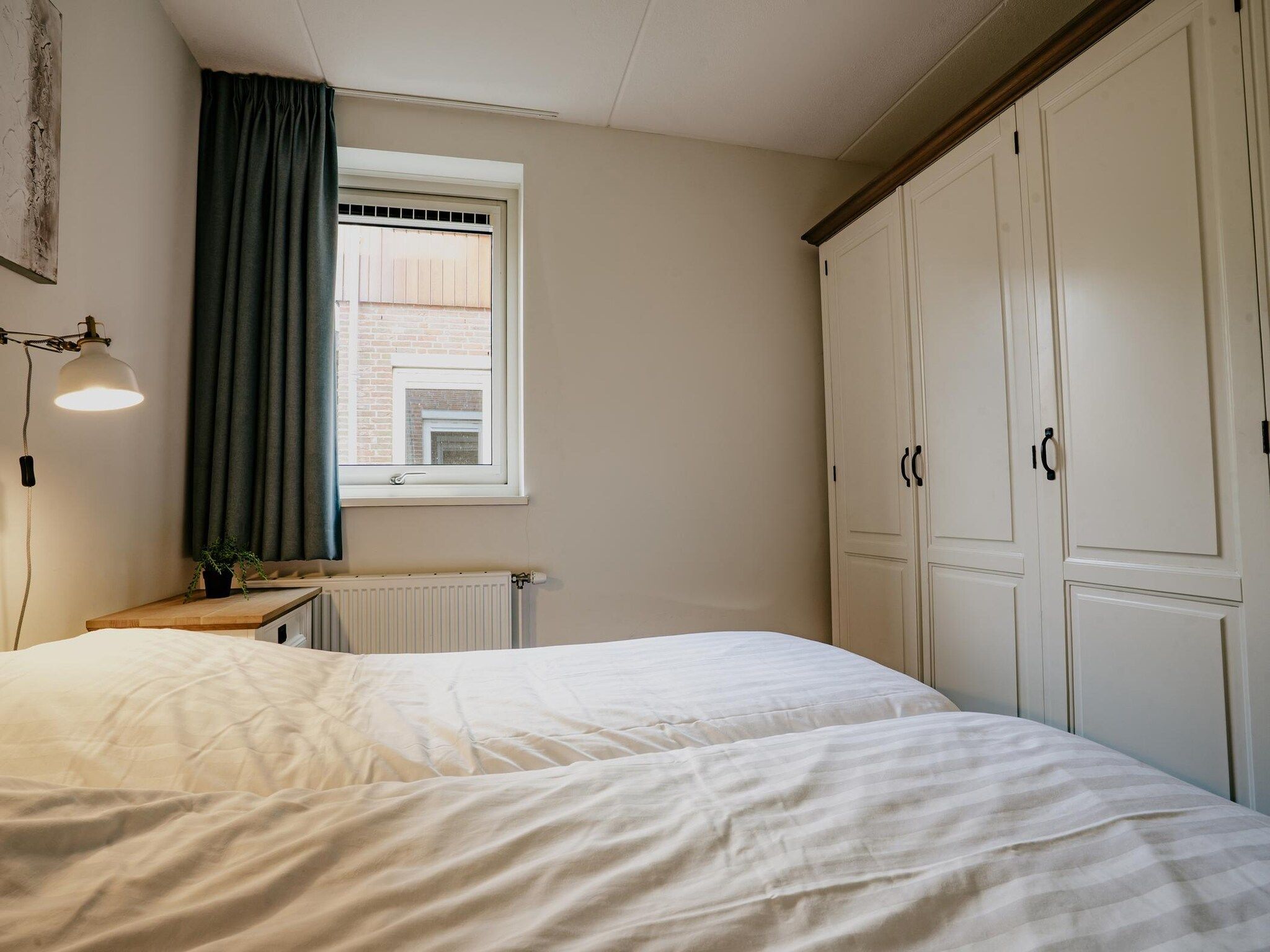 Een slaapkamer van Waterpark de Meerparel  1 in Uitgeest