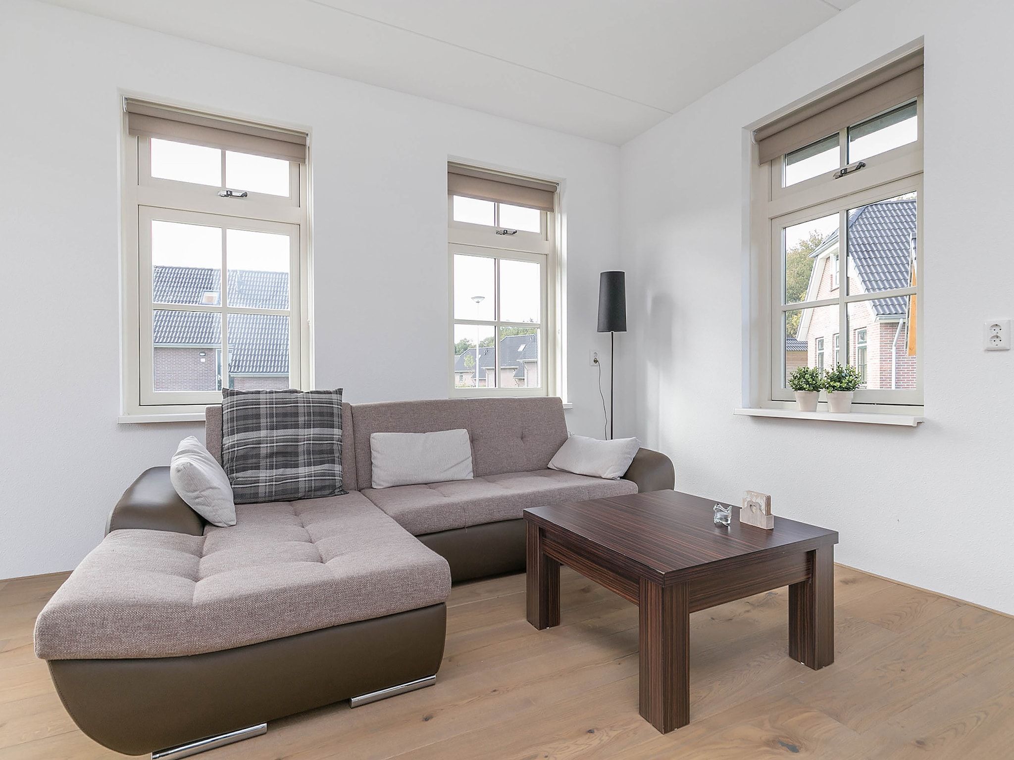 De woonkamer van Villaparc Schoonhovenseland in Hollandscheveld