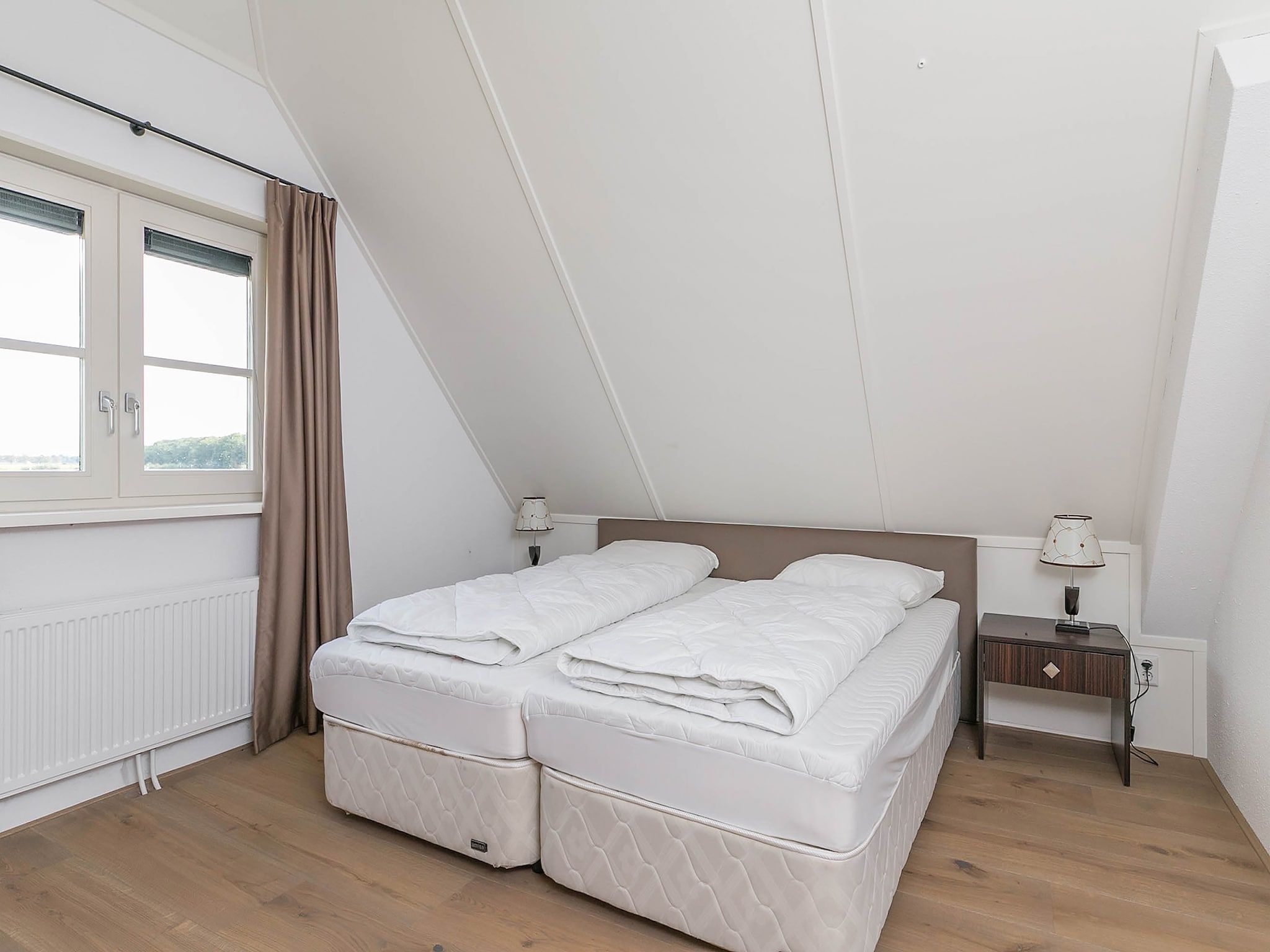 Een slaapkamer van Villaparc Schoonhovenseland in Hollandscheveld