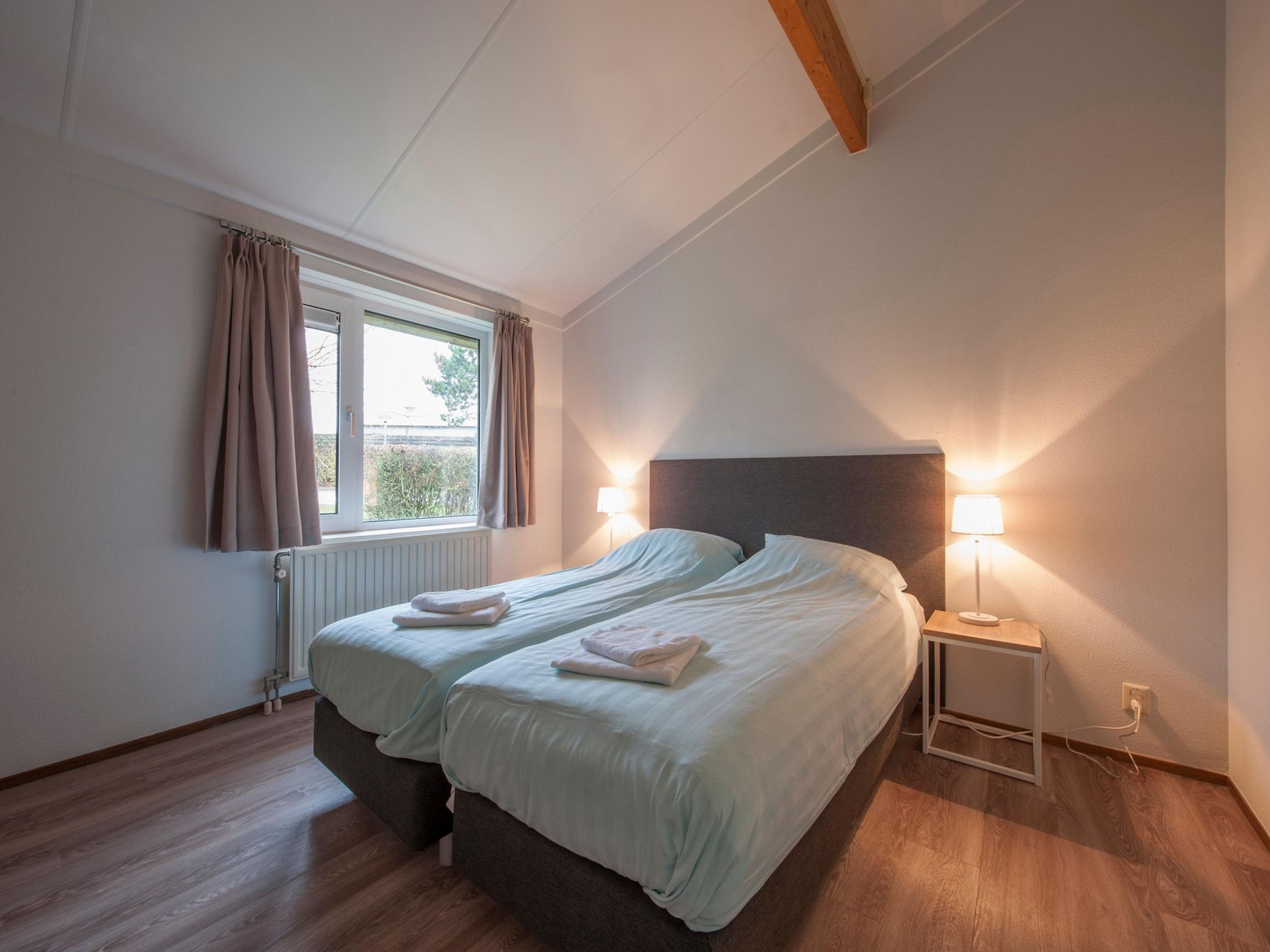Een slaapkamer van Vakantiepark Hof Domburg 11 in Domburg