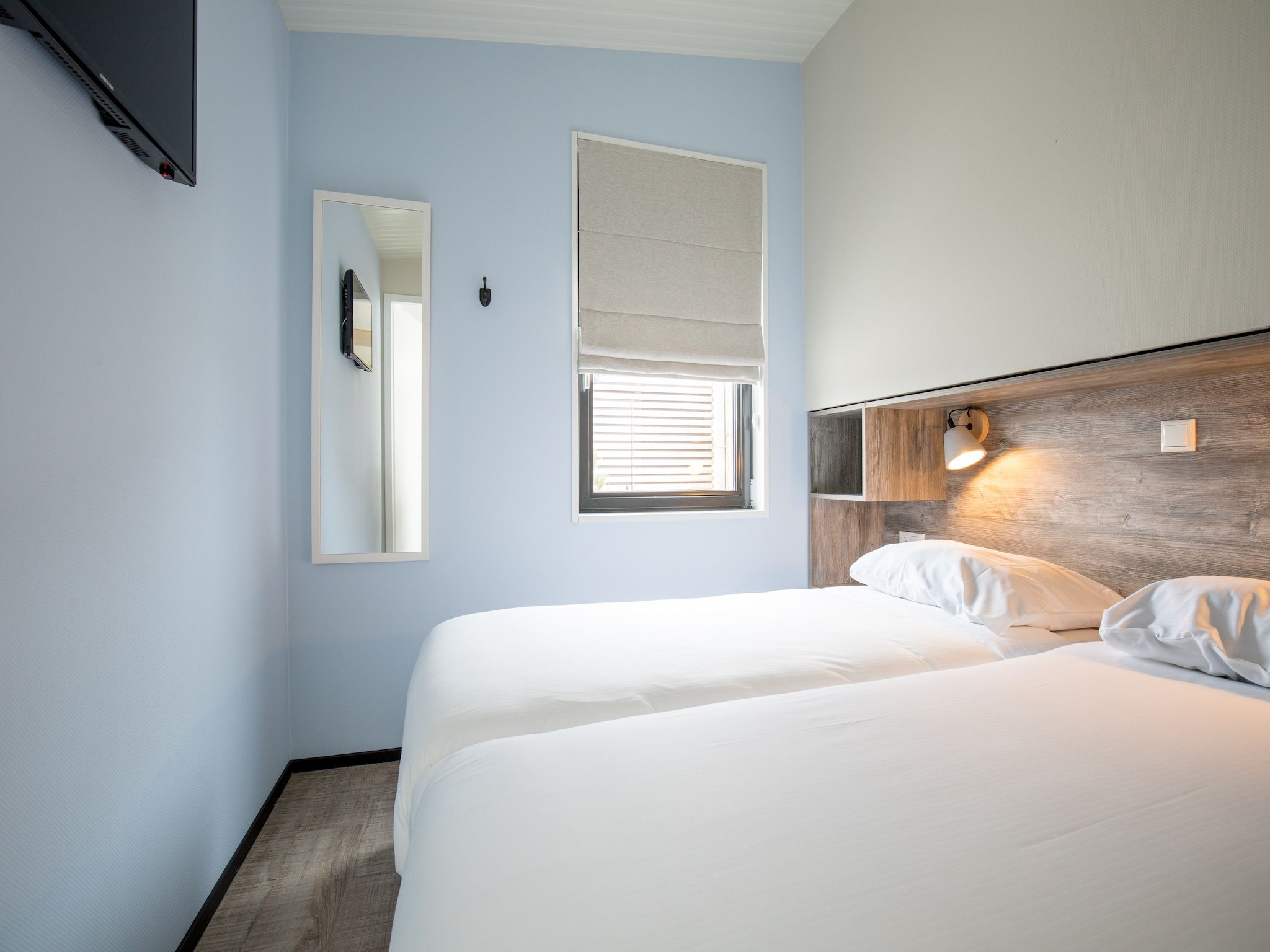 Een slaapkamer van Sea Lodges Ameland 5 in Hollum