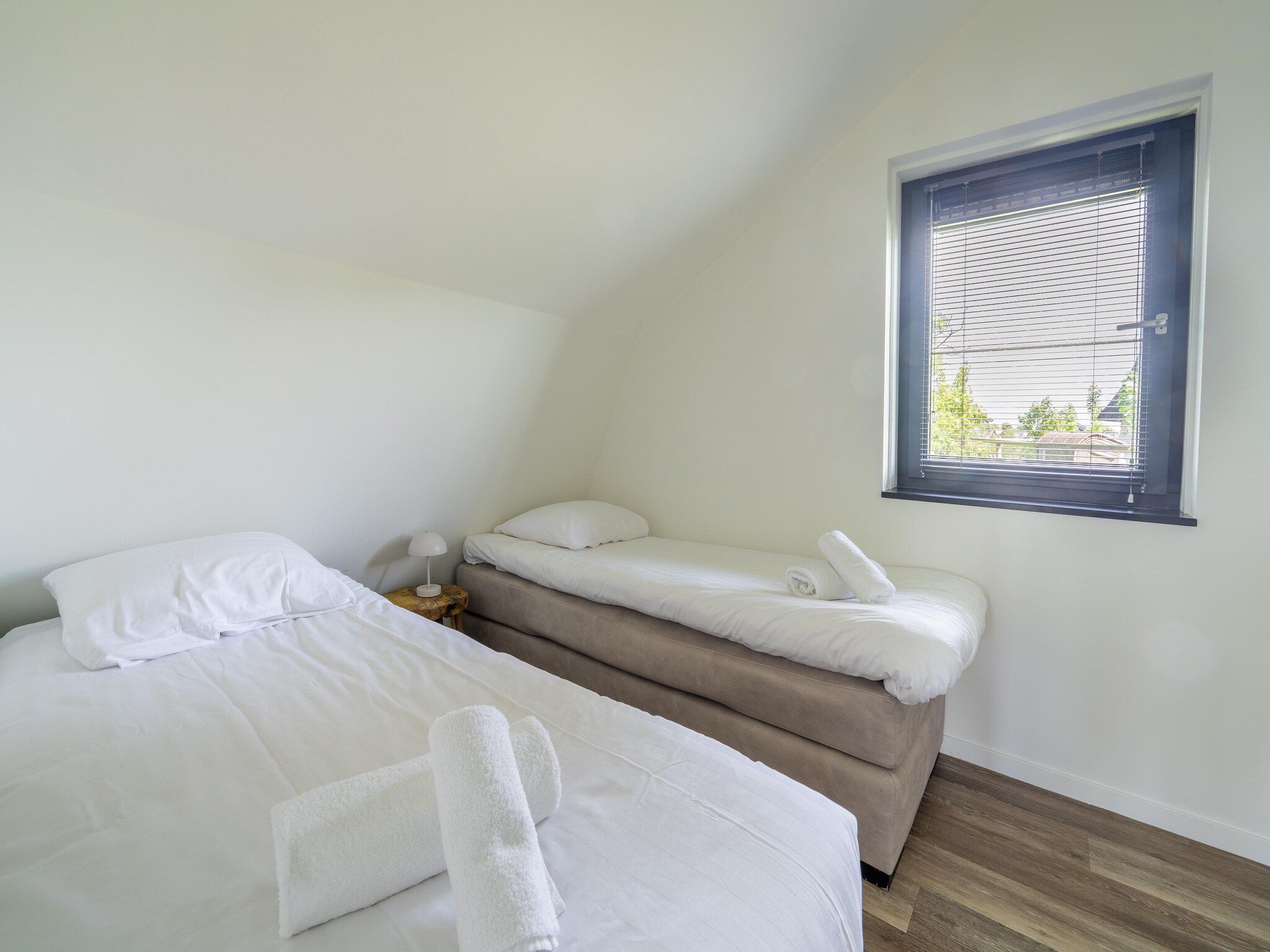 Een slaapkamer van Onder de molen in Egmond aan den Hoef