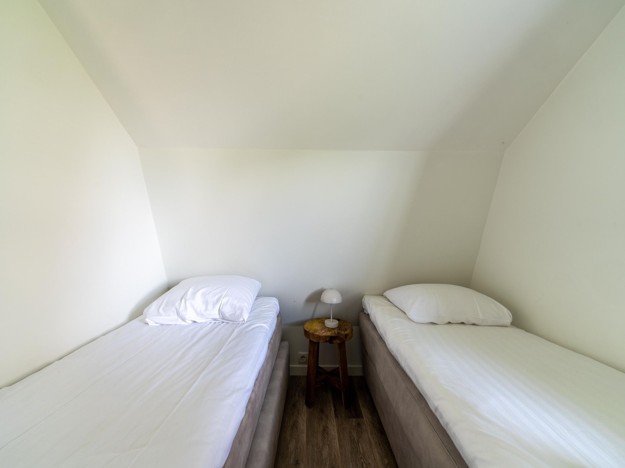 Een slaapkamer van Onder de molen in Egmond aan den Hoef