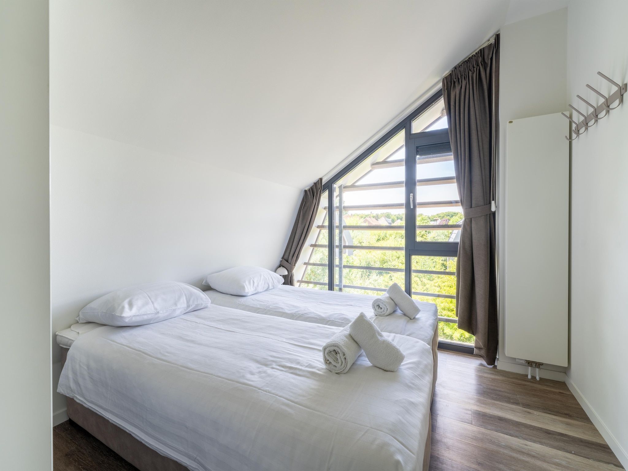 Een slaapkamer van Onder de molen in Egmond aan den Hoef