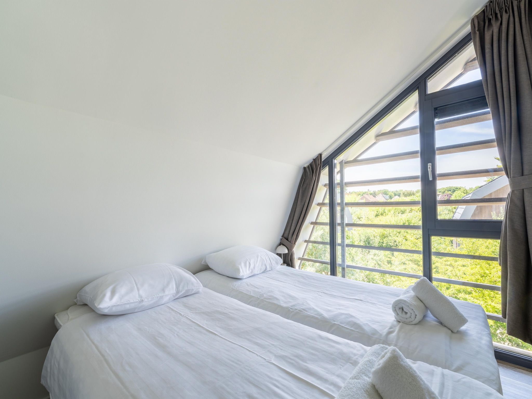 Een slaapkamer van Onder de molen in Egmond aan den Hoef