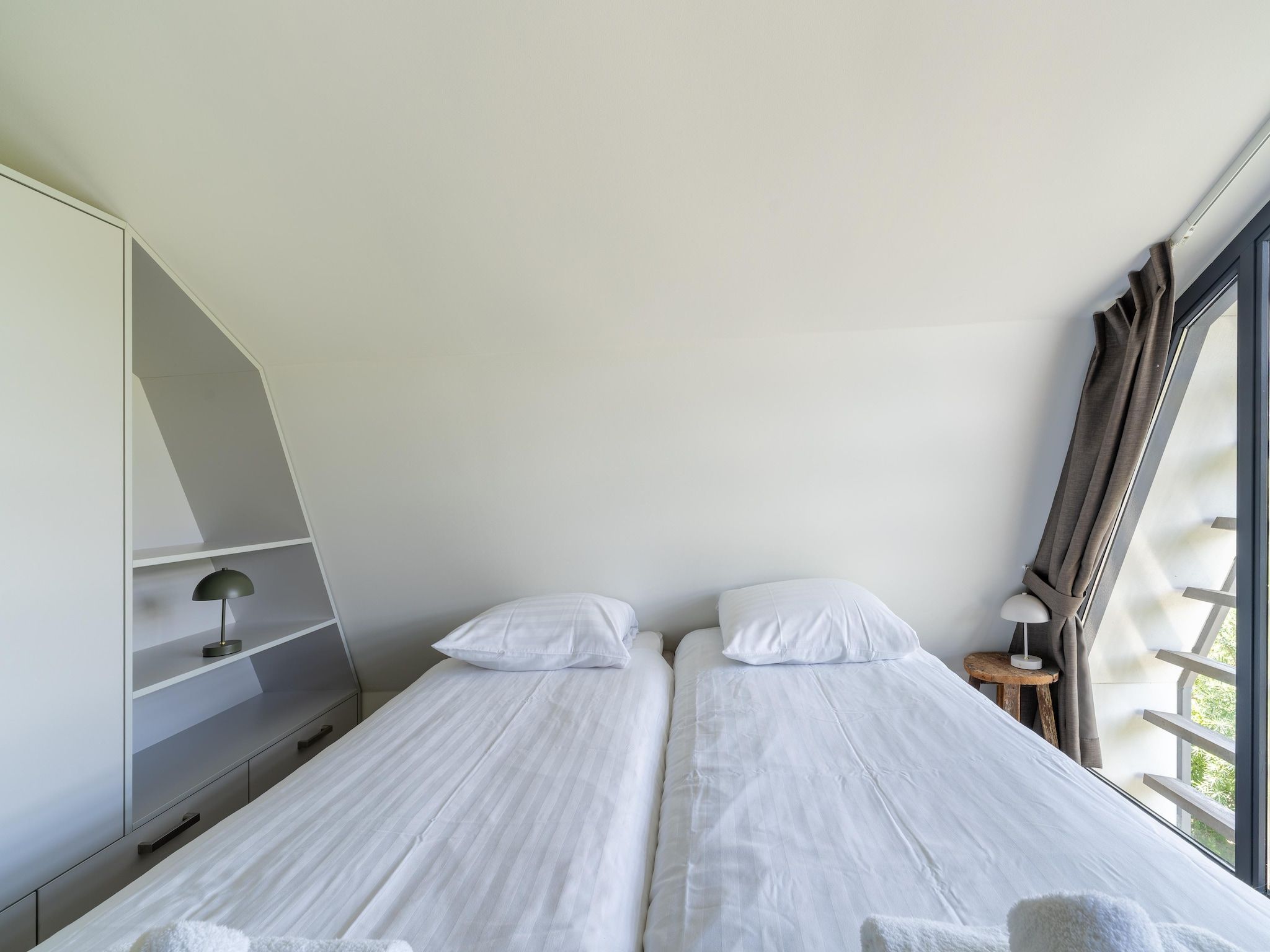 Een slaapkamer van Onder de molen in Egmond aan den Hoef