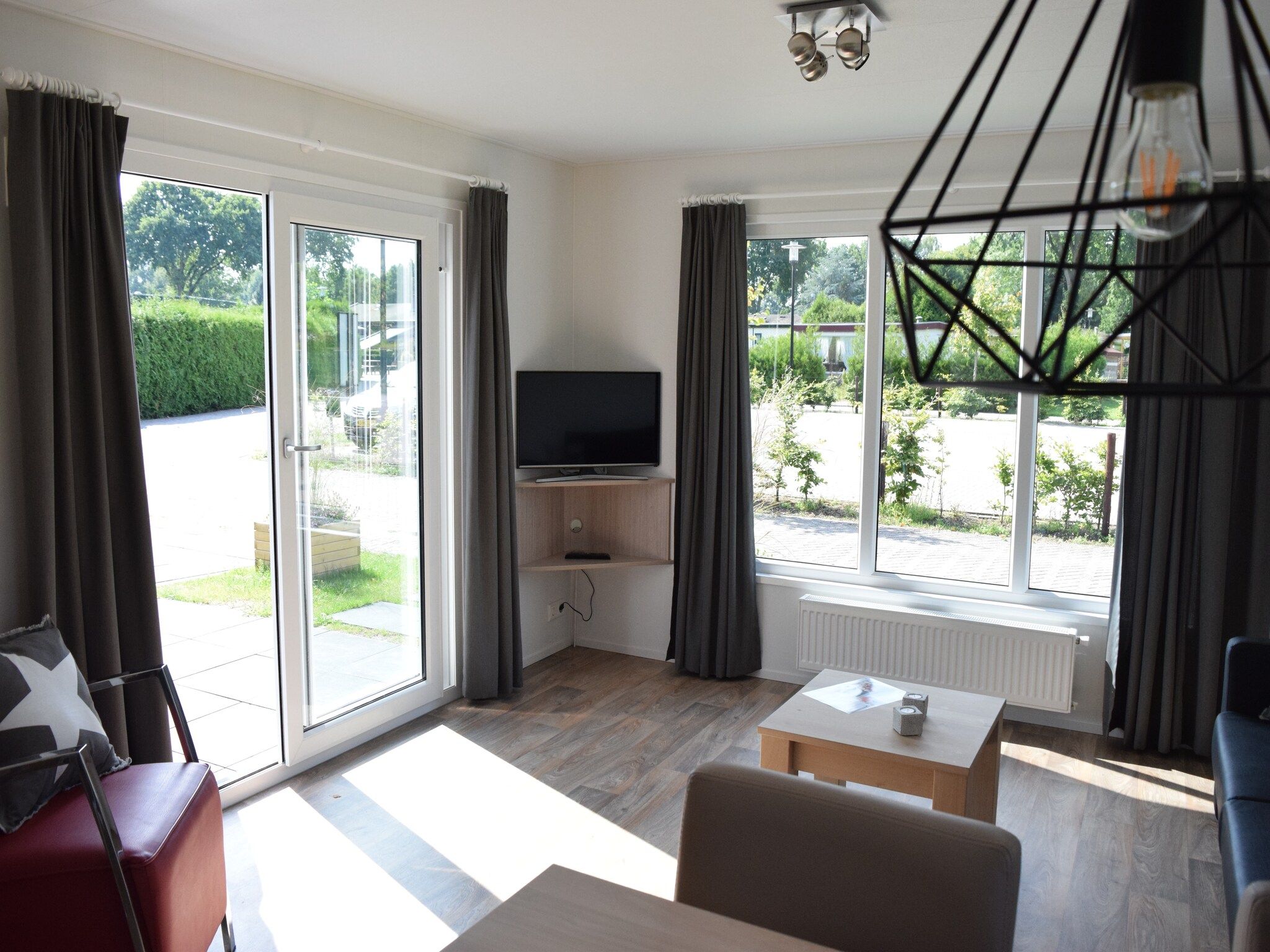 De woonkamer van Recreatiepark de Boshoek 4 in Voorthuizen