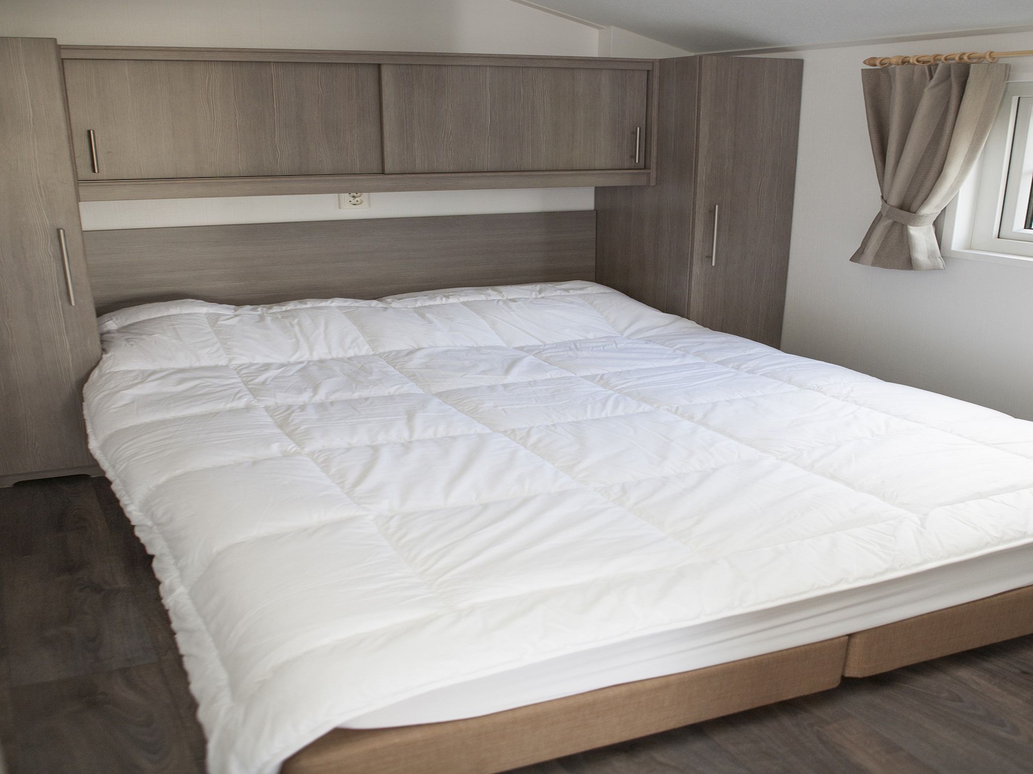 Een slaapkamer van Recreatiepark de Boshoek 6 in Voorthuizen