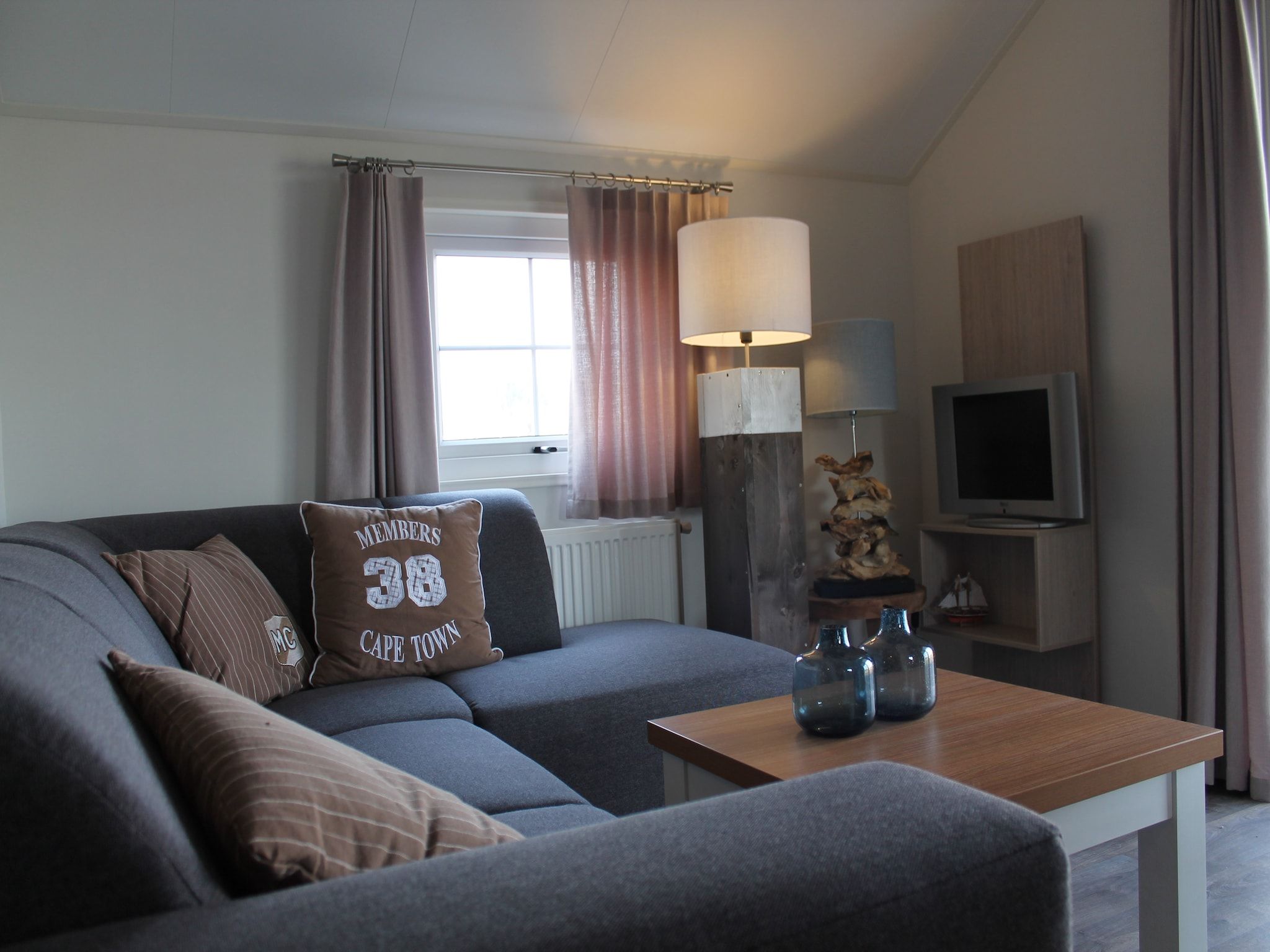 De woonkamer van Recreatiepark de Boshoek 7 in Voorthuizen