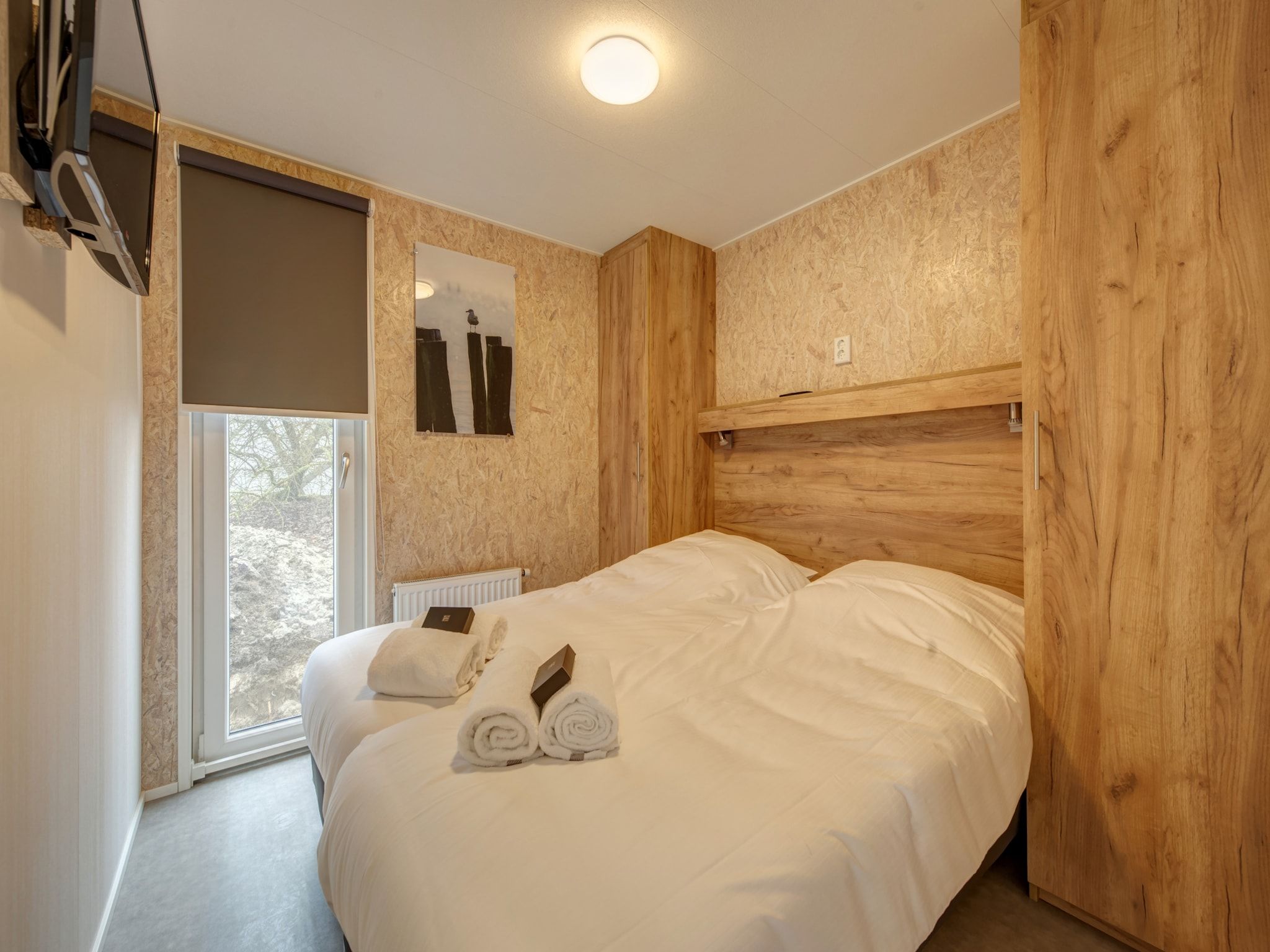 Een slaapkamer van Vakantiepark Kijkduin 1 in Den Haag