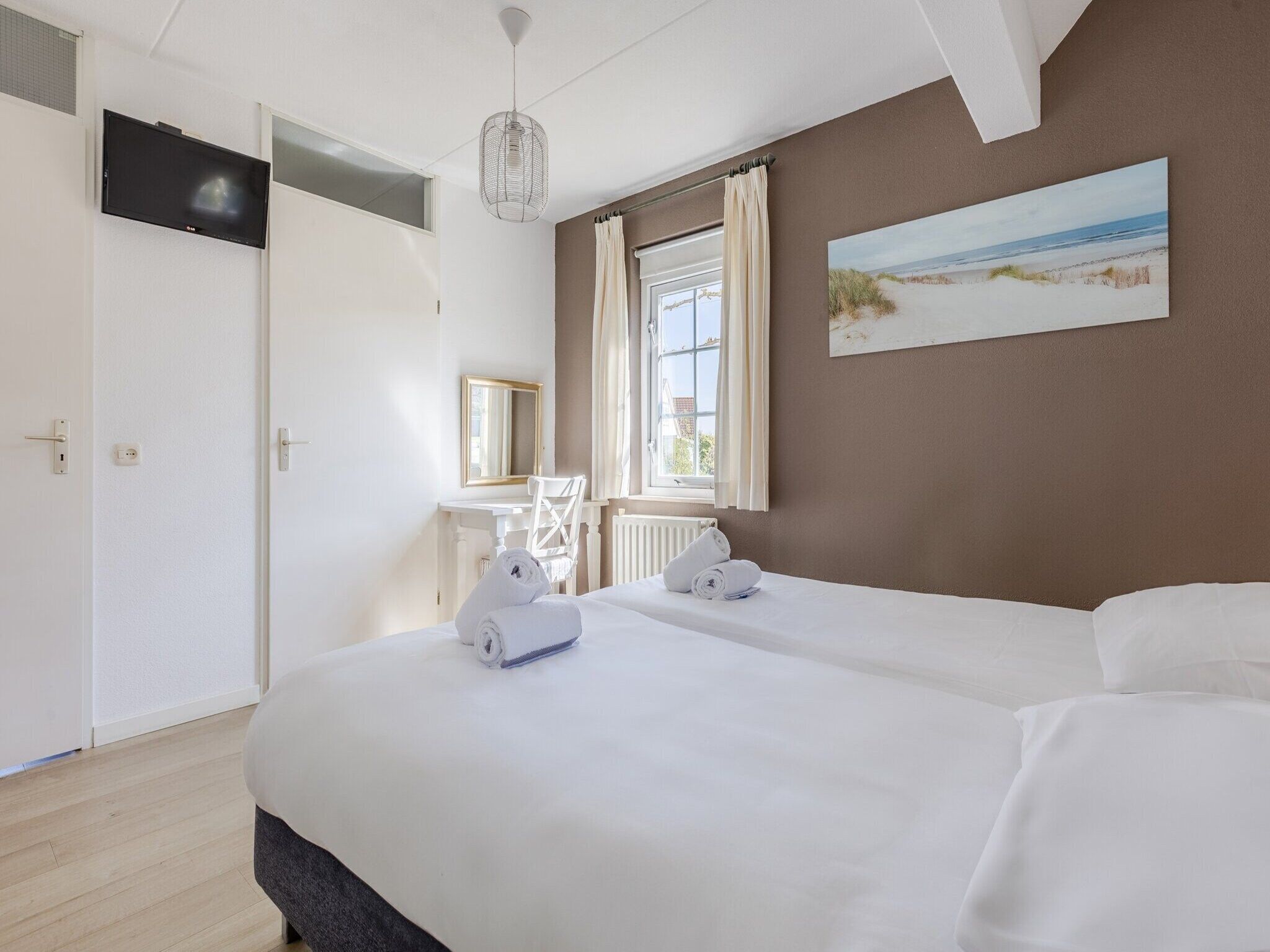 Een slaapkamer van Buitenhof Domburg 12 in Domburg