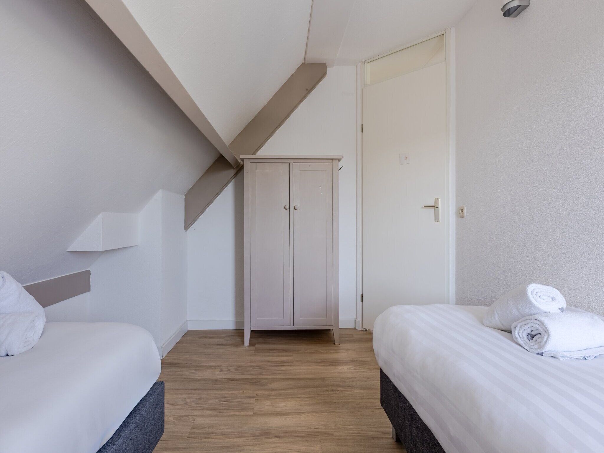 Een slaapkamer van Buitenhof Domburg 12 in Domburg