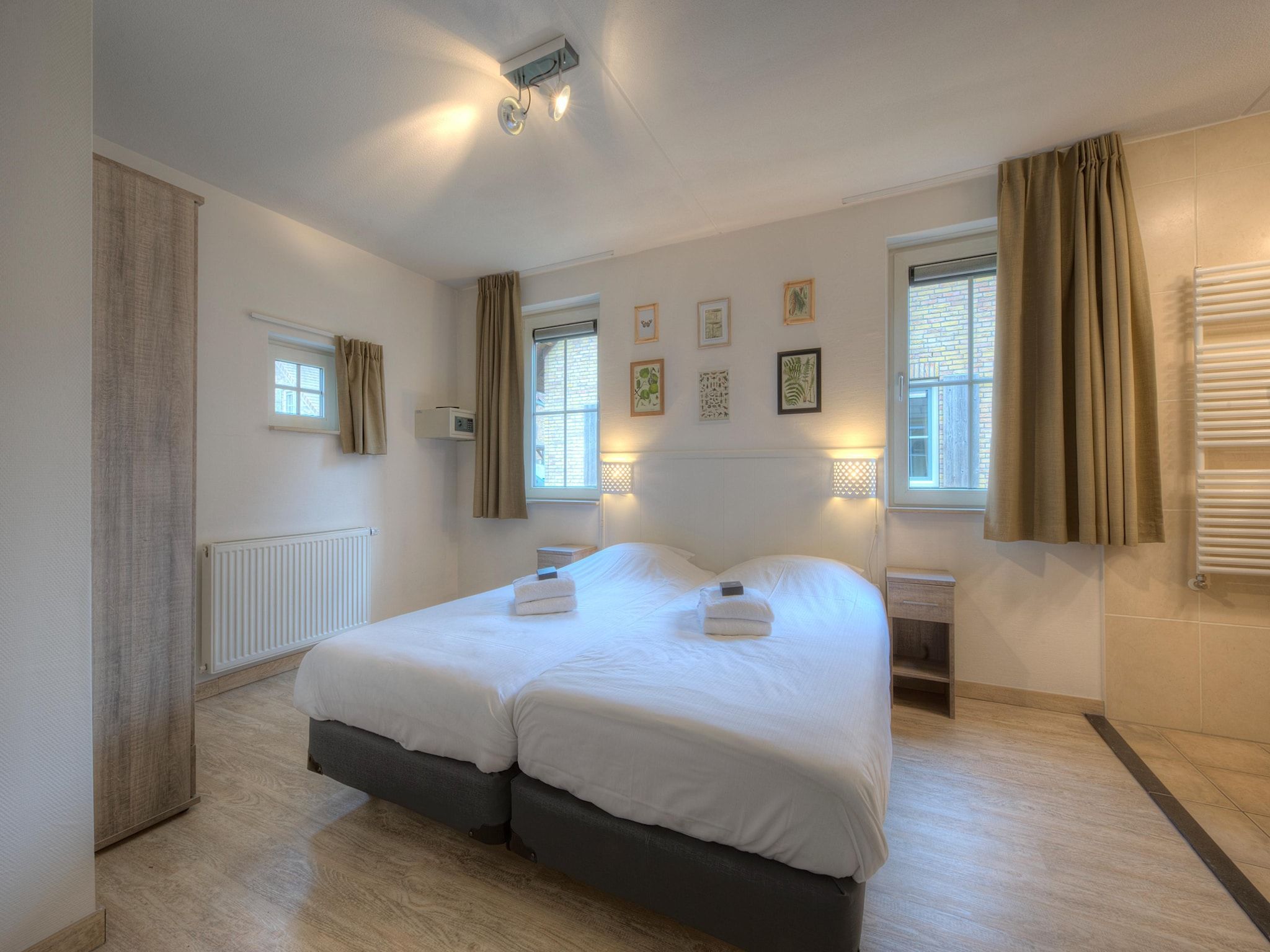 Een slaapkamer van Vakantiepark Weerterbergen 5 in Weert