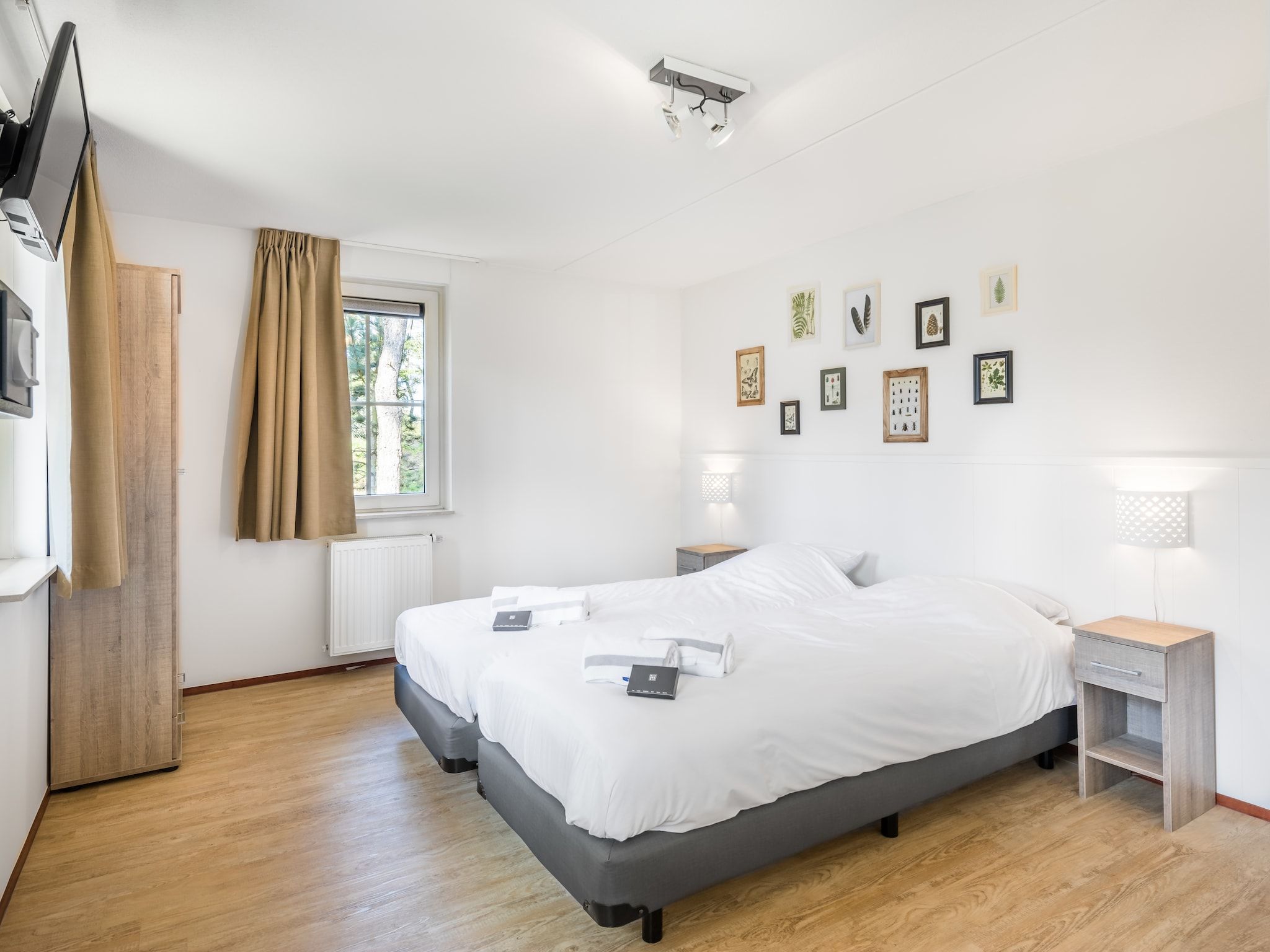 Een slaapkamer van Vakantiepark Weerterbergen 7 in Weert