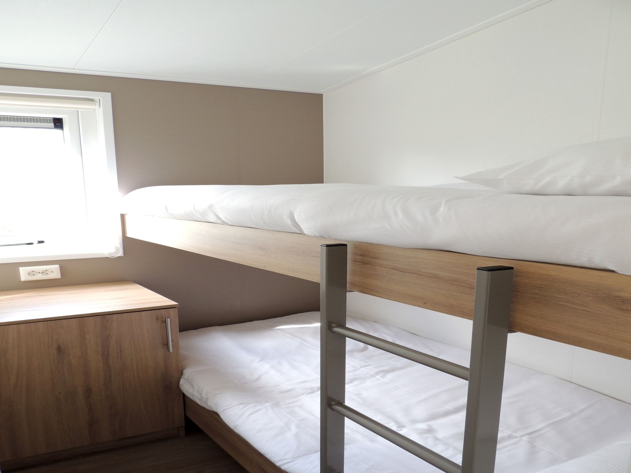 Een slaapkamer van Recreatiepark de Boshoek 20 in Voorthuizen