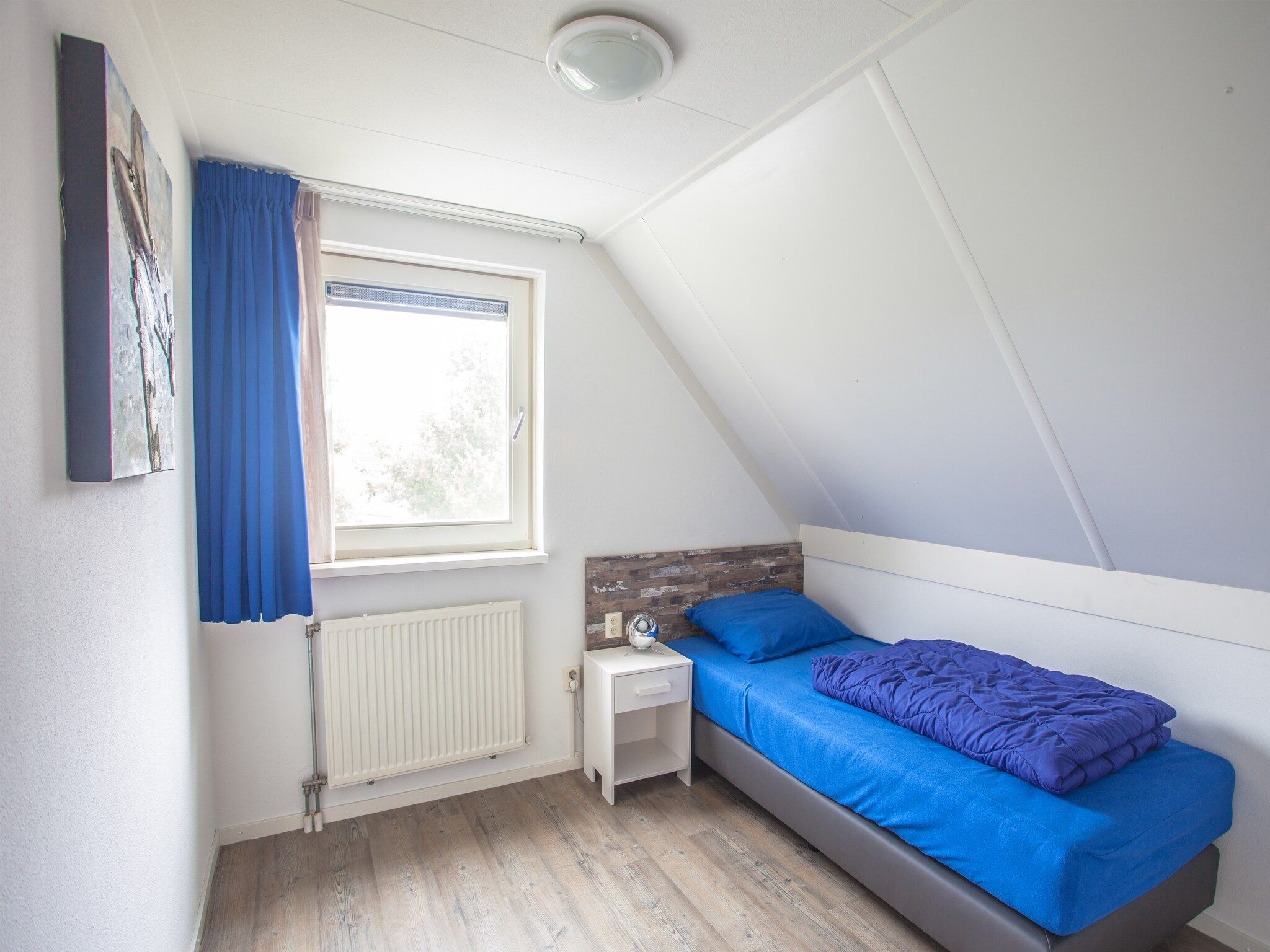 Een slaapkamer van Dijkhuis 6 in Medemblik